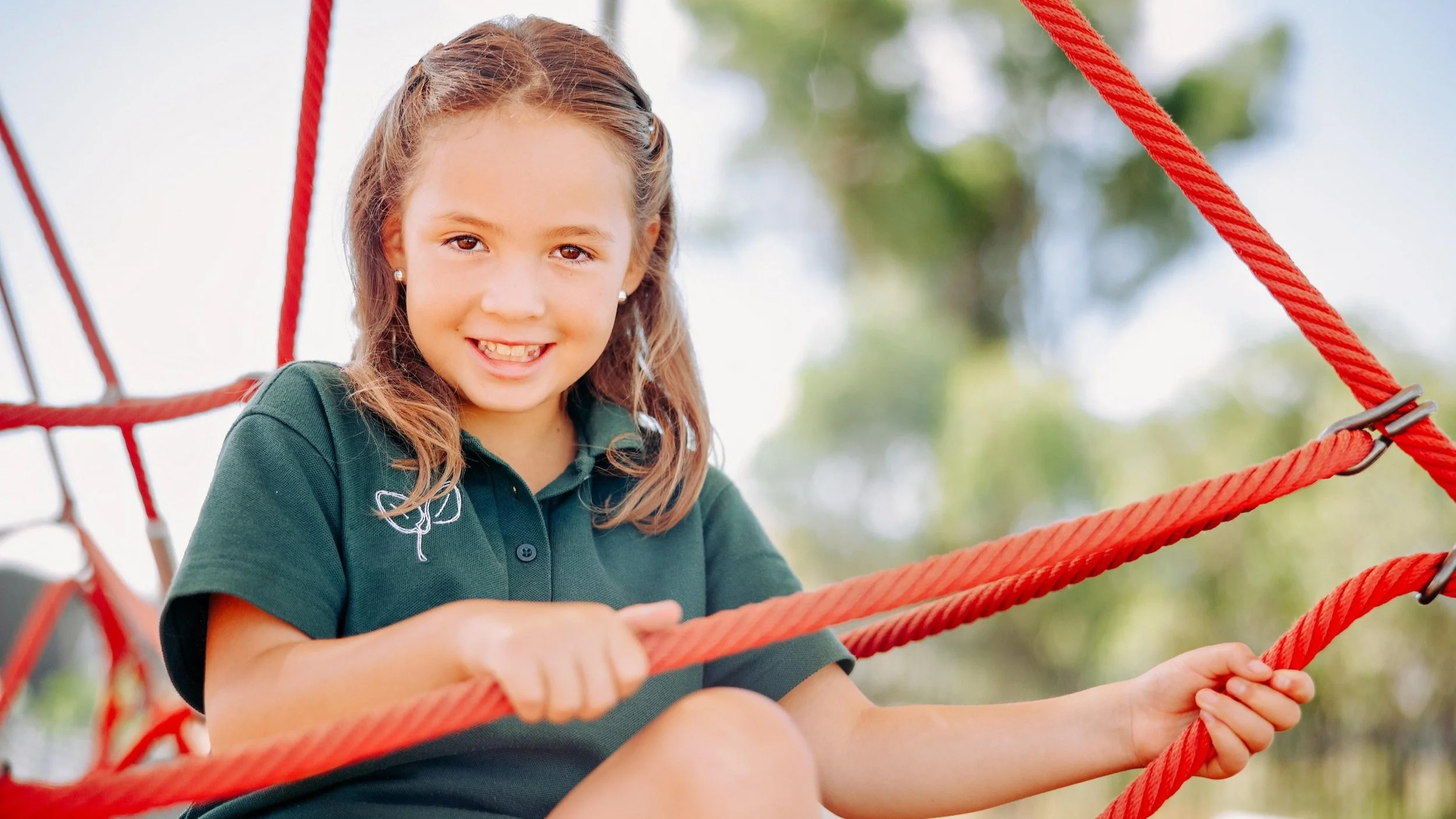 Canberra school photos - child on playground smiling