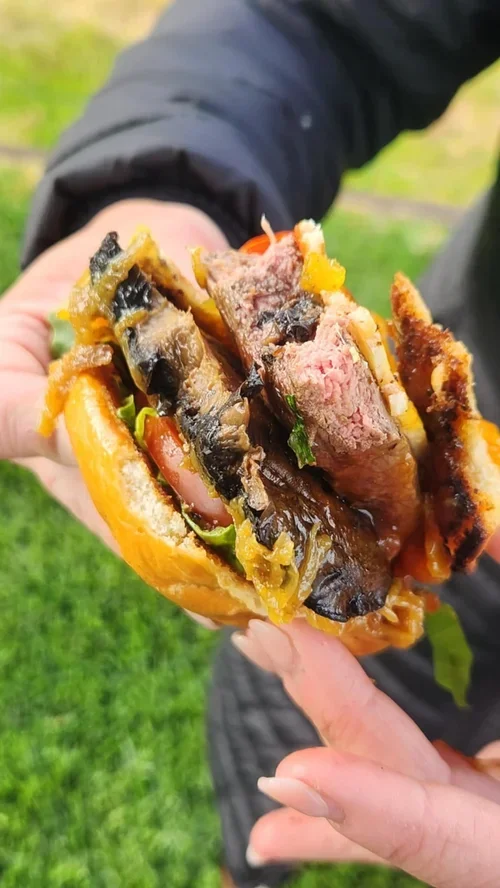 Enjoying a Brooksmanor Beef loaded blade steak burger.webp