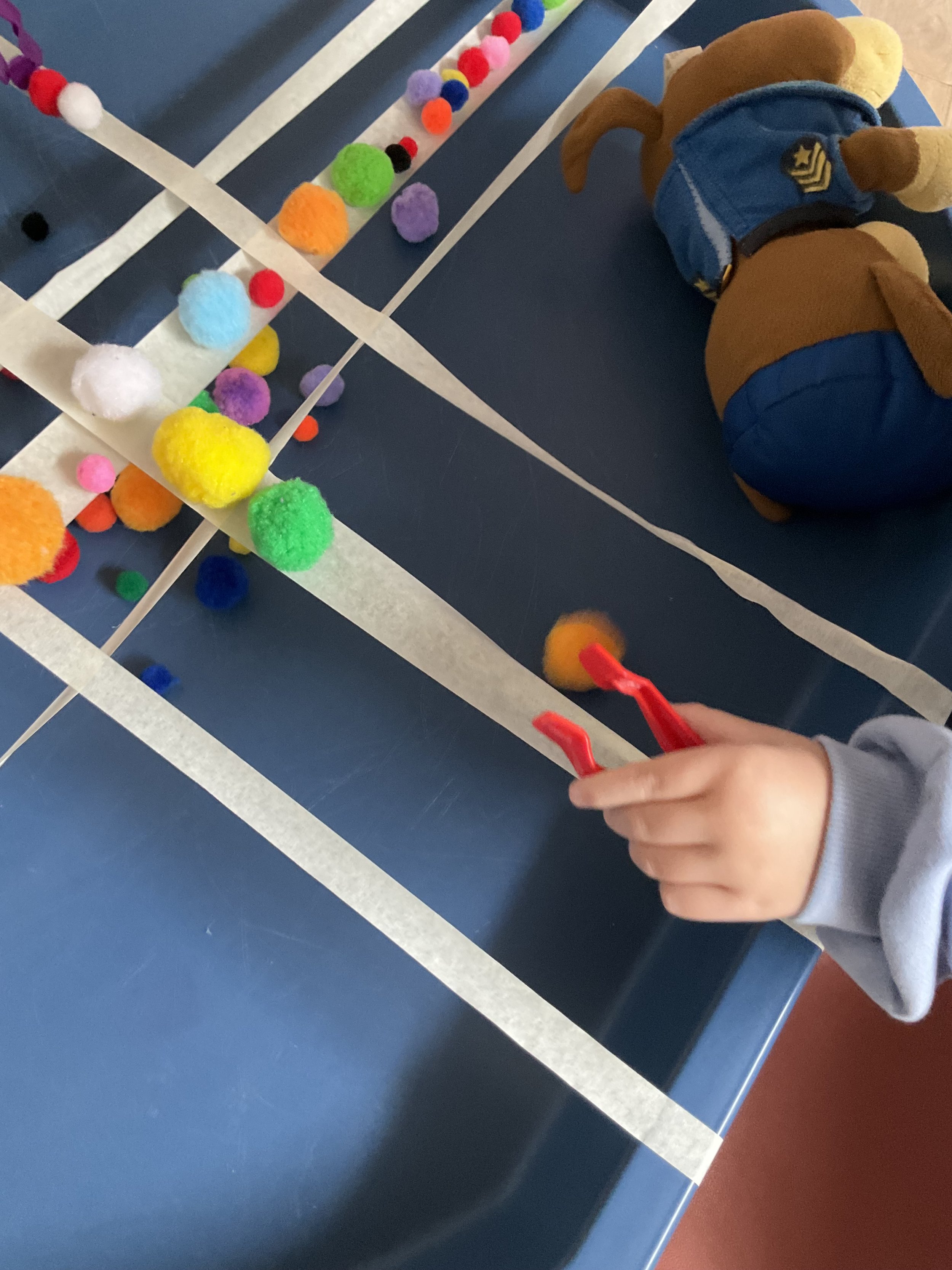 Balance Challenge using Pom Poms