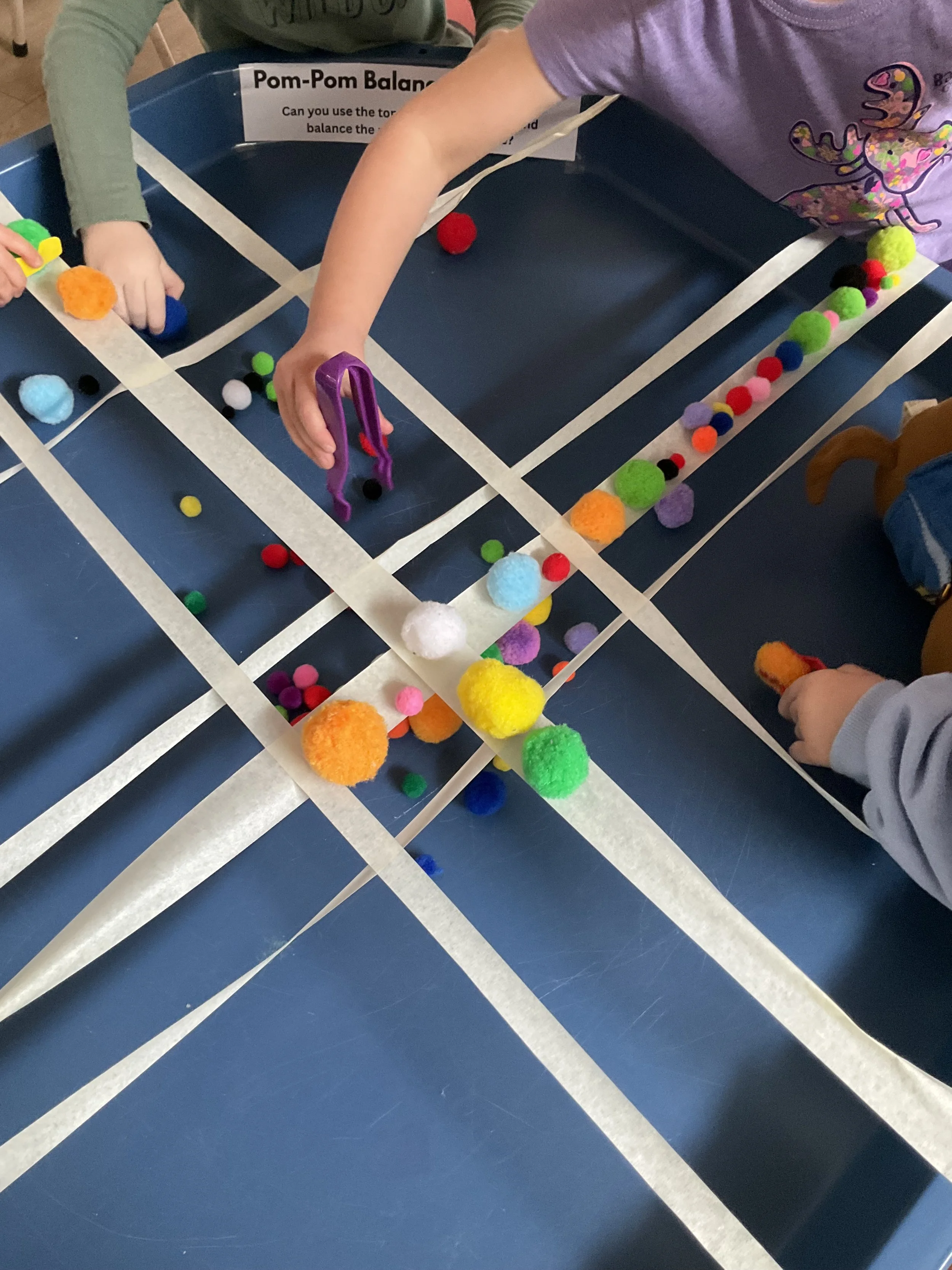 Balance Challenge using Pom Poms