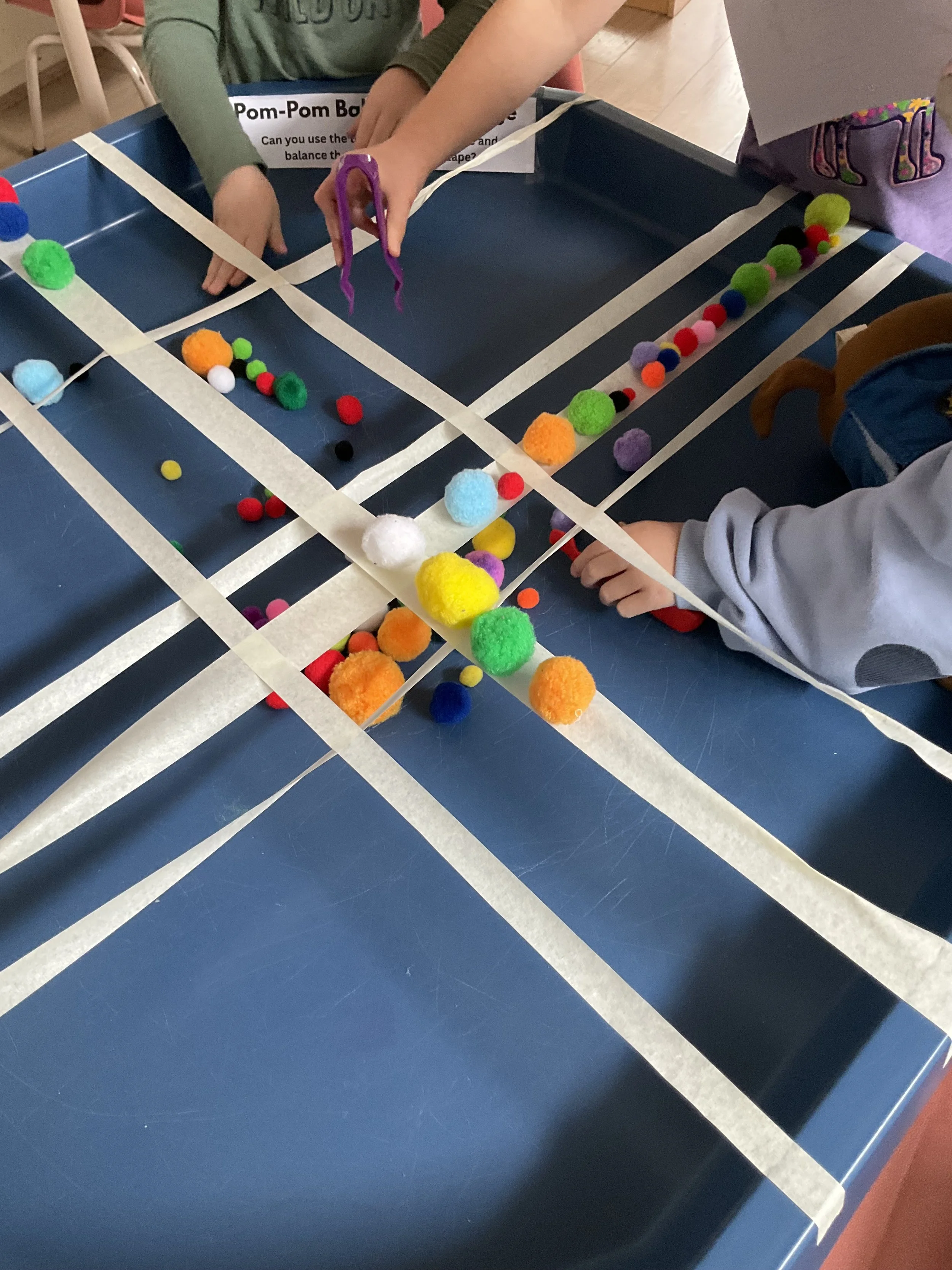 Balance Challenge using Pom Poms