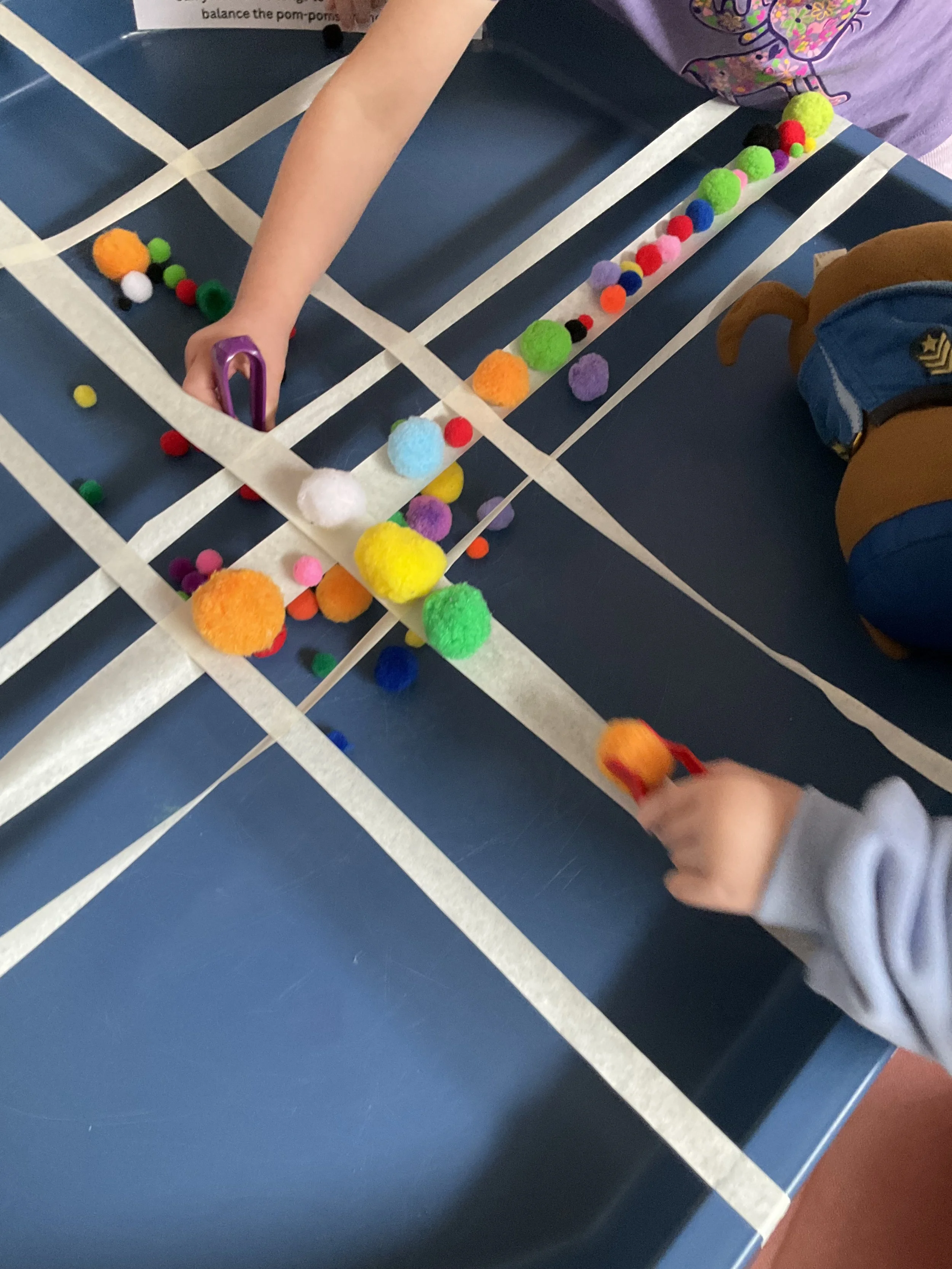 Balance Challenge using Pom Poms