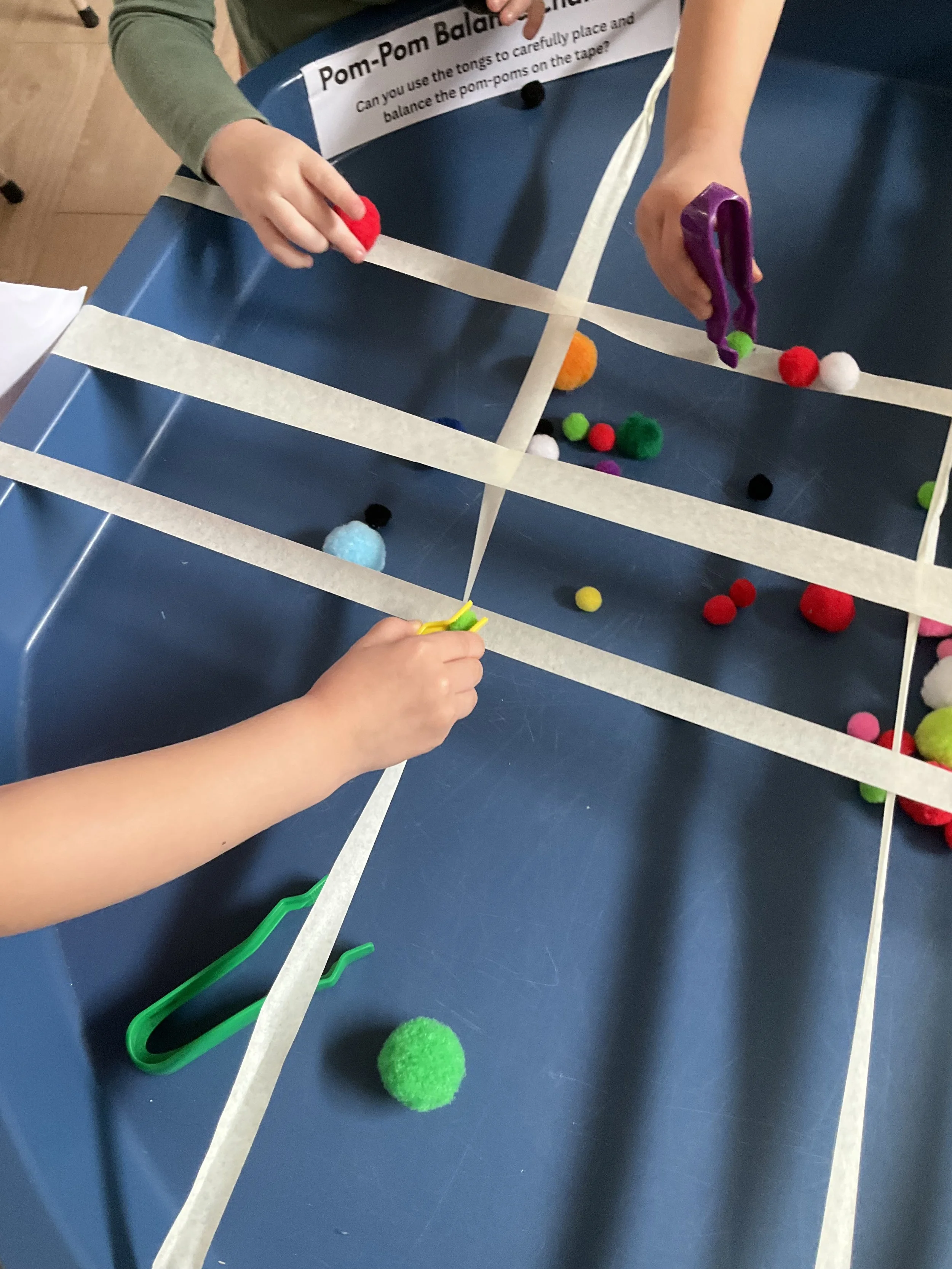 Balance Challenge using Pom Poms