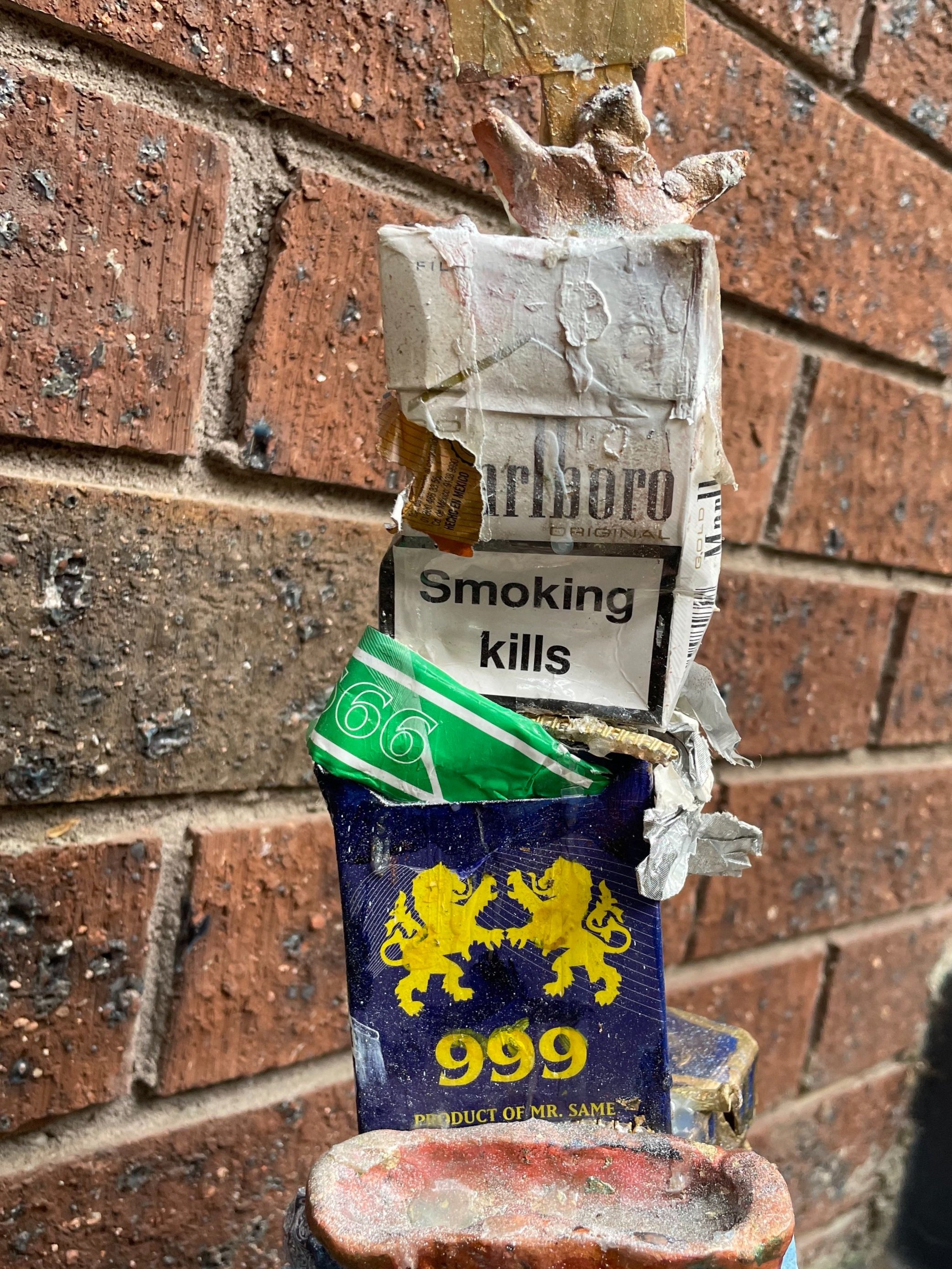 CLOSE+UP+CIGARETTE+TOWER+GODDOG+ART+UPCYCLED+SCULPTURE+MADE+FROM+OLD+CIGARETTE+PACKAGING.jpg