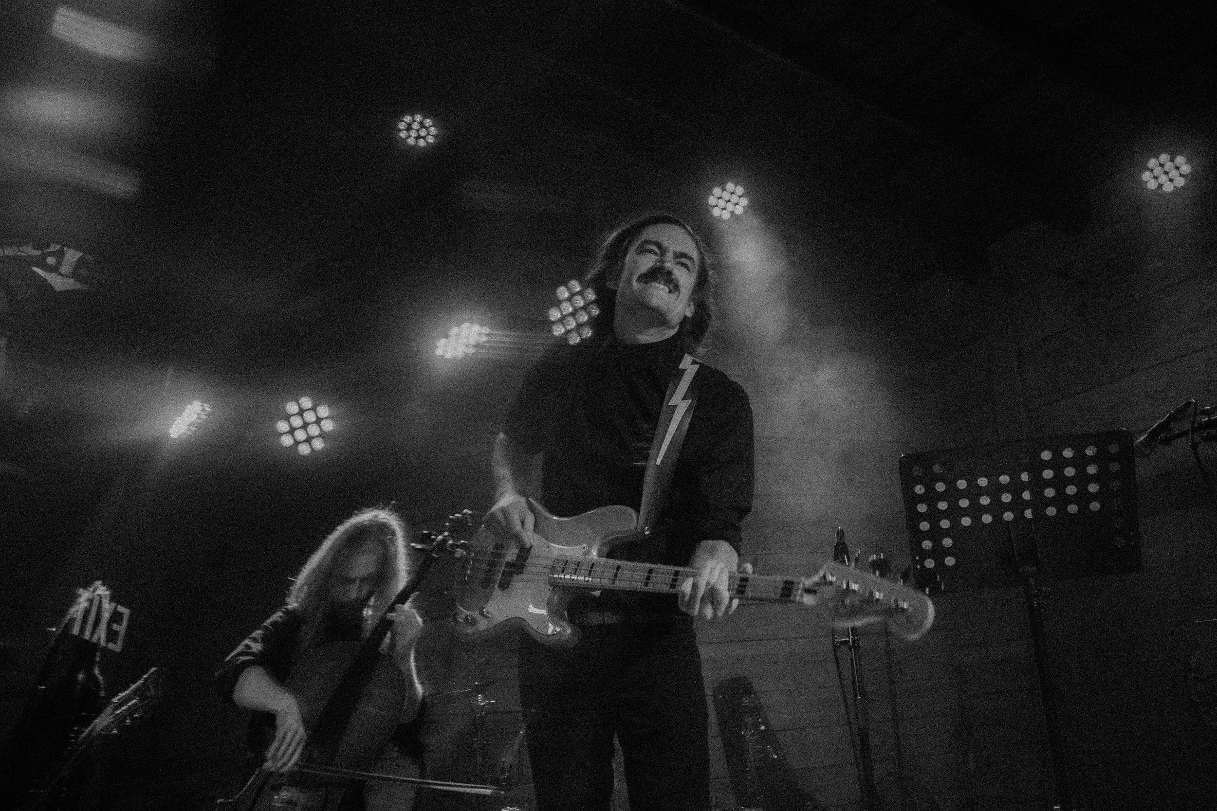 Gersh Godwin and Seth Murphy in black and white, live on stage in Cam Clark's Orchestra.