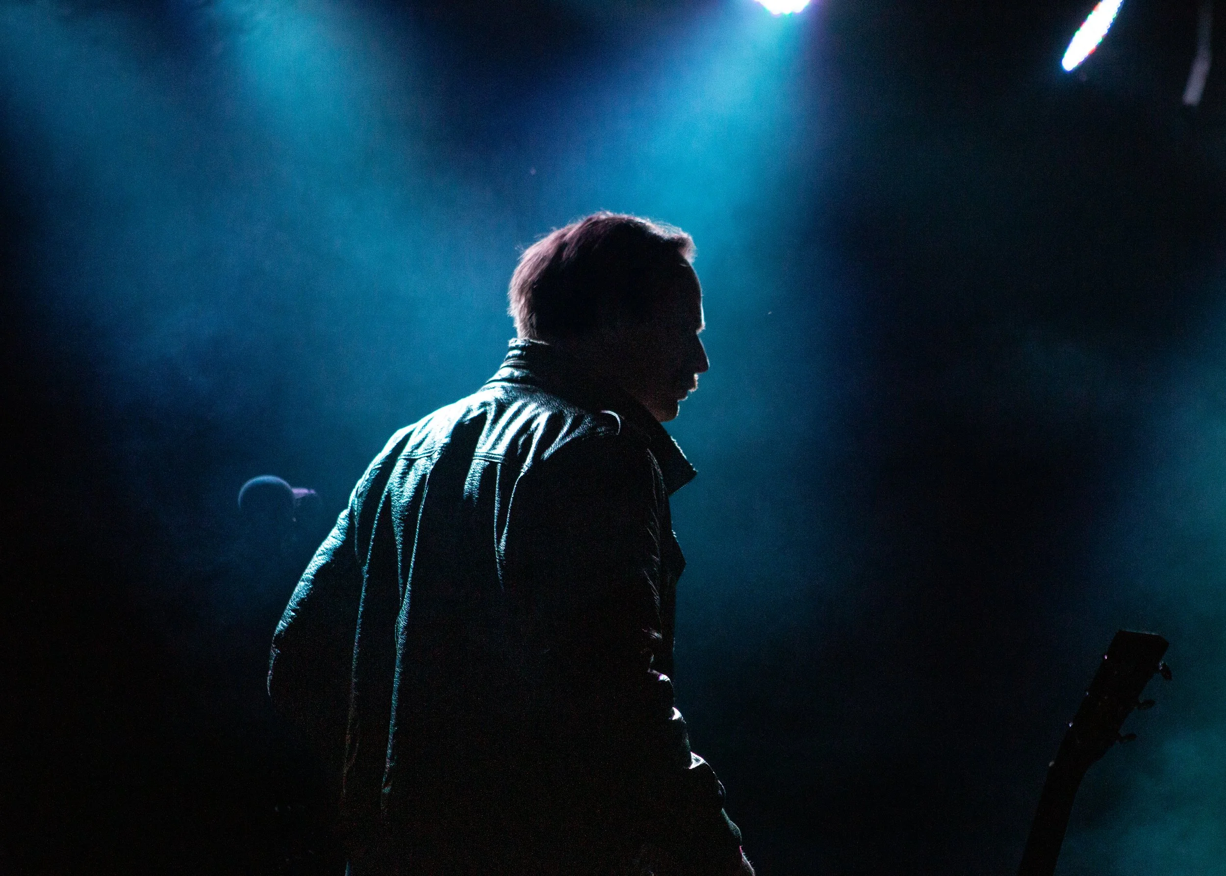 Saxophonist Shannon Vetter on stage surrounded by fog and blue lights, in Cam Clark's Orchestra.