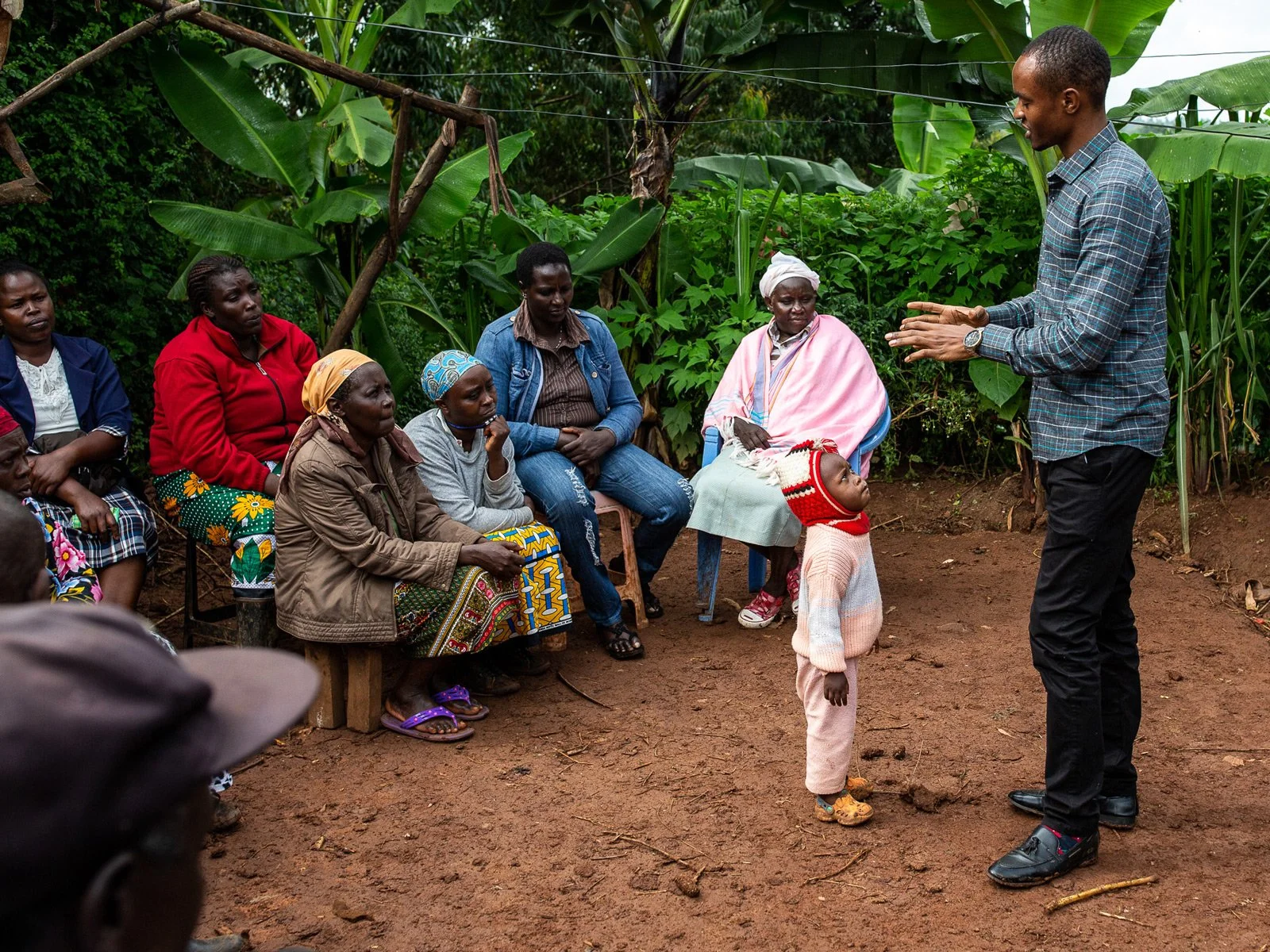 The Hand in Hand instructor is talking to the farmers.