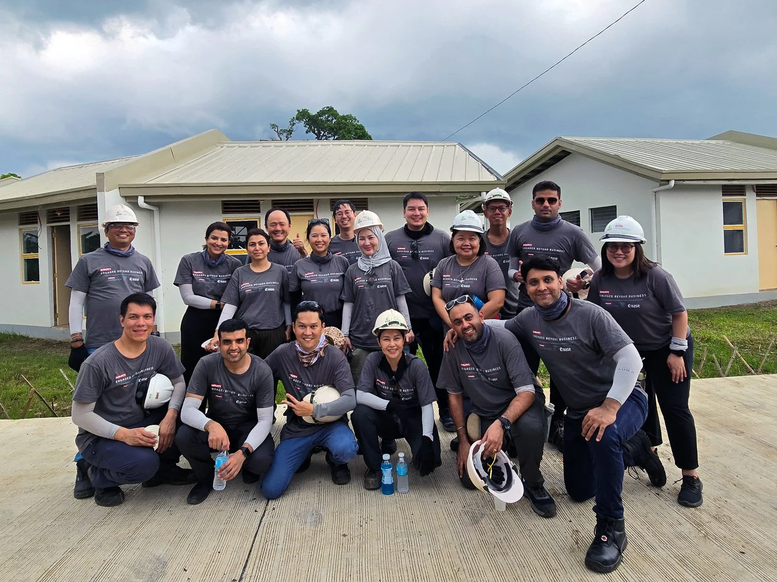 Hilti workers building houses in the Philippines through the EBB corporate volunteering program.