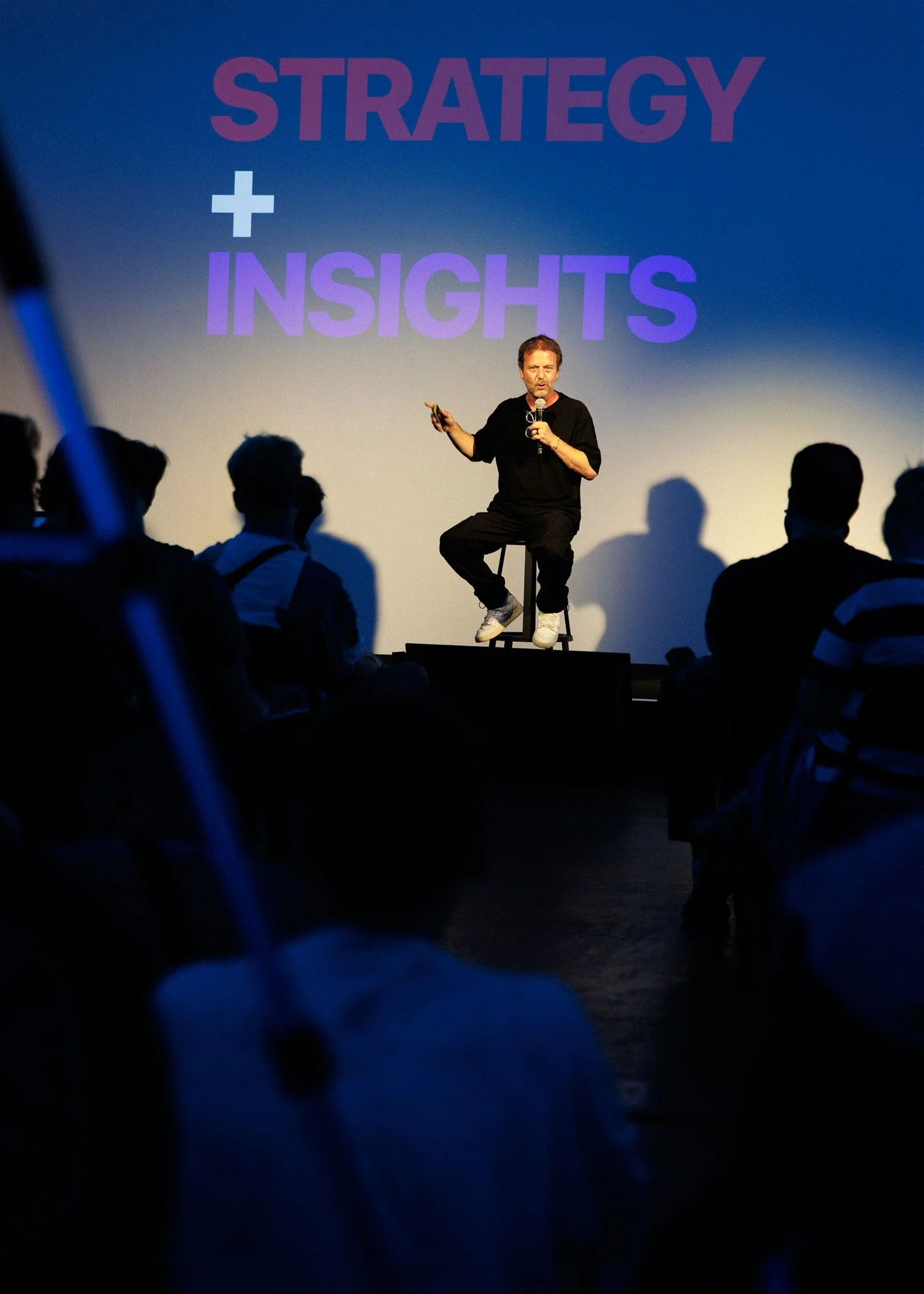 A speaker on stage at Protein Studios London captured by a professional event photographer
