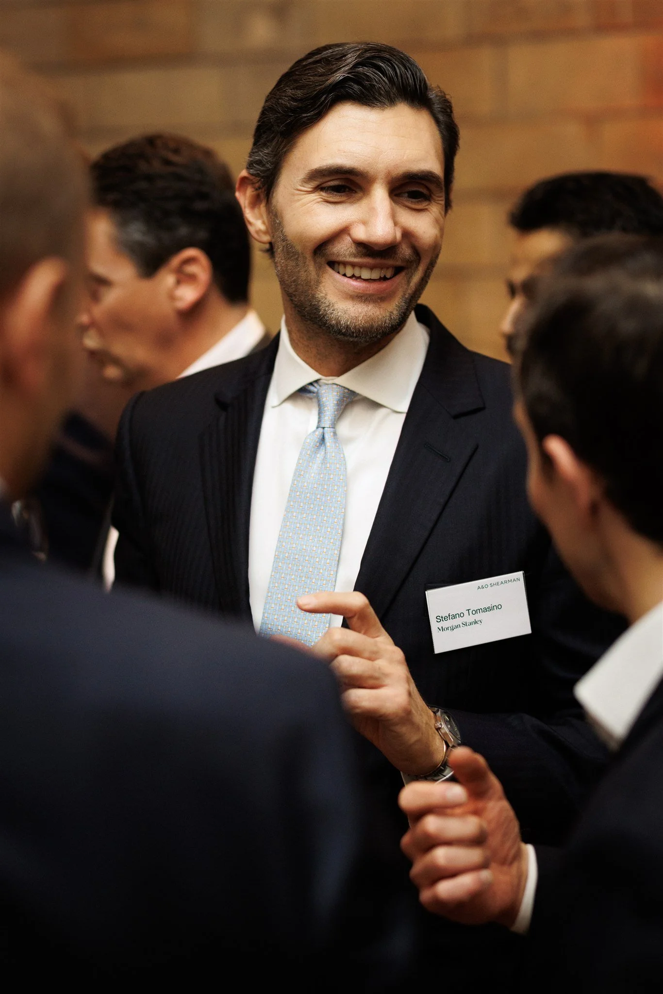 Event photograph of a formal corporate dinner guest in London