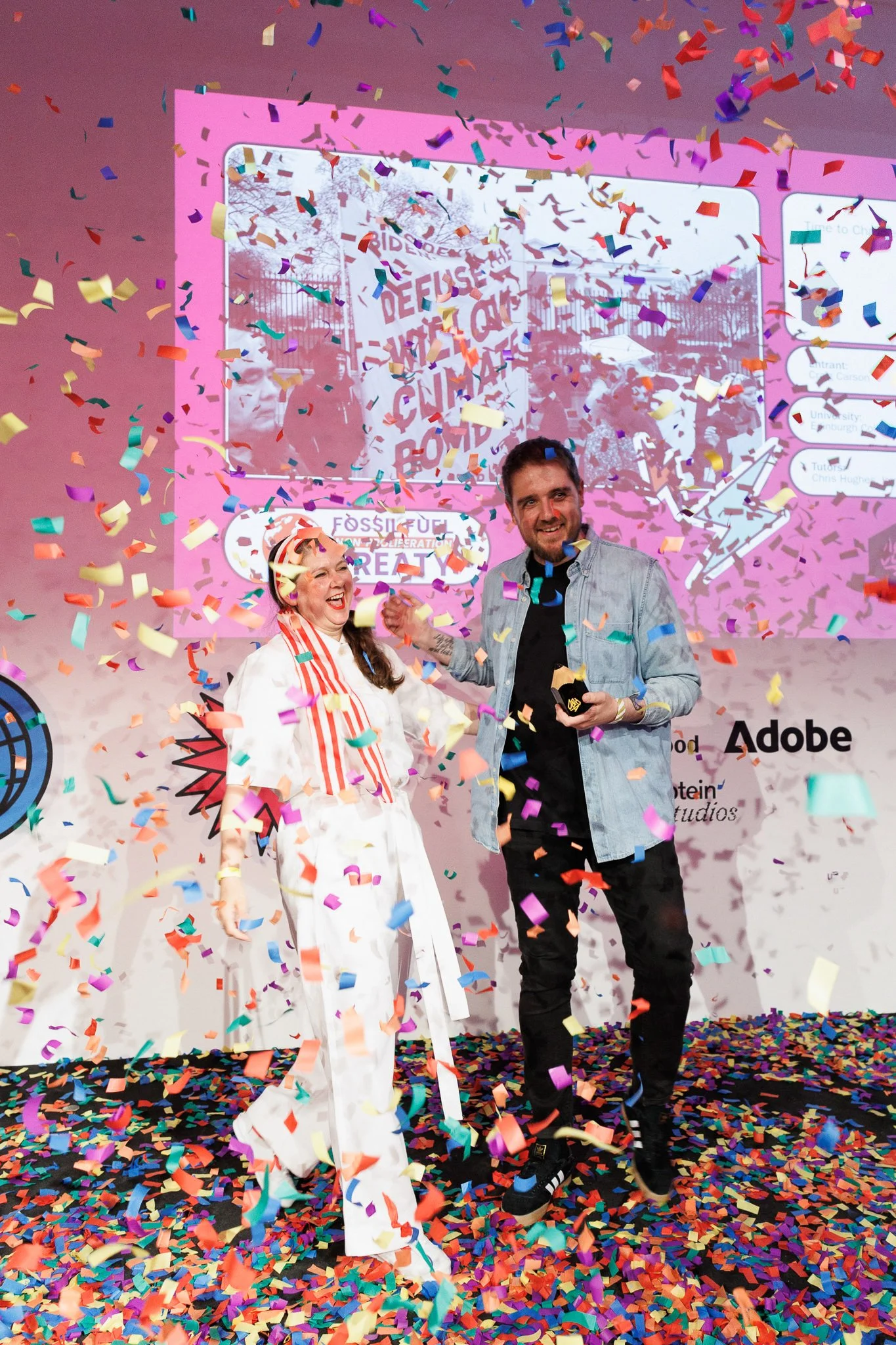 Award winners celebrating on stage under a shower of colorful confetti at the D&AD New Blood Awards, Protein Studios.