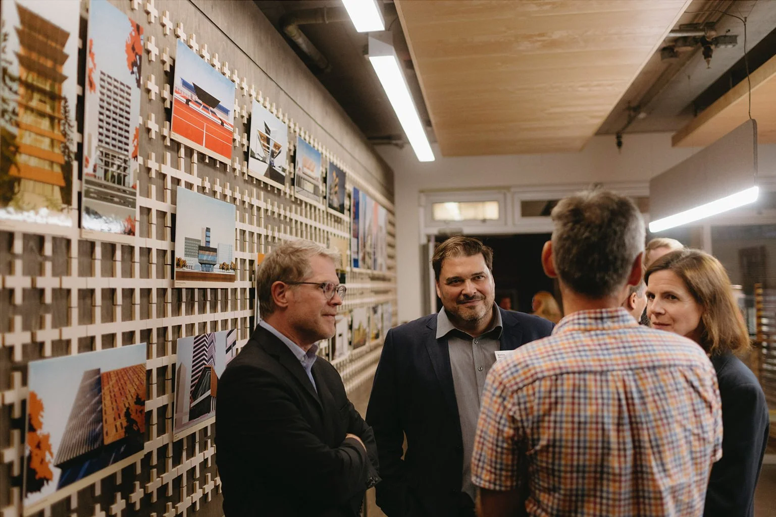 Candid corporate conference photography in London showing attendees engaged in discussions