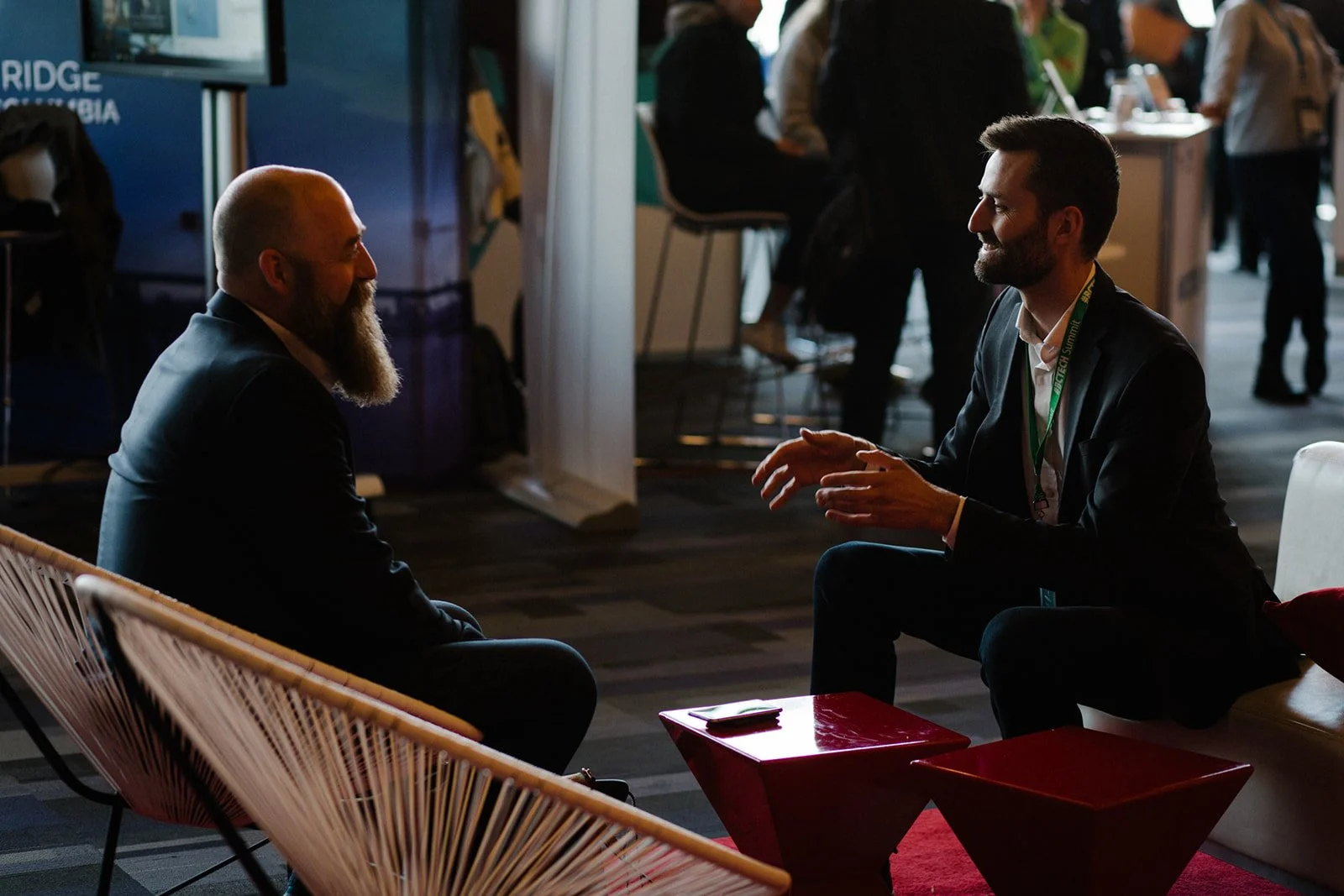 Conference networking photography showing business professionals in conversation during a corporate event