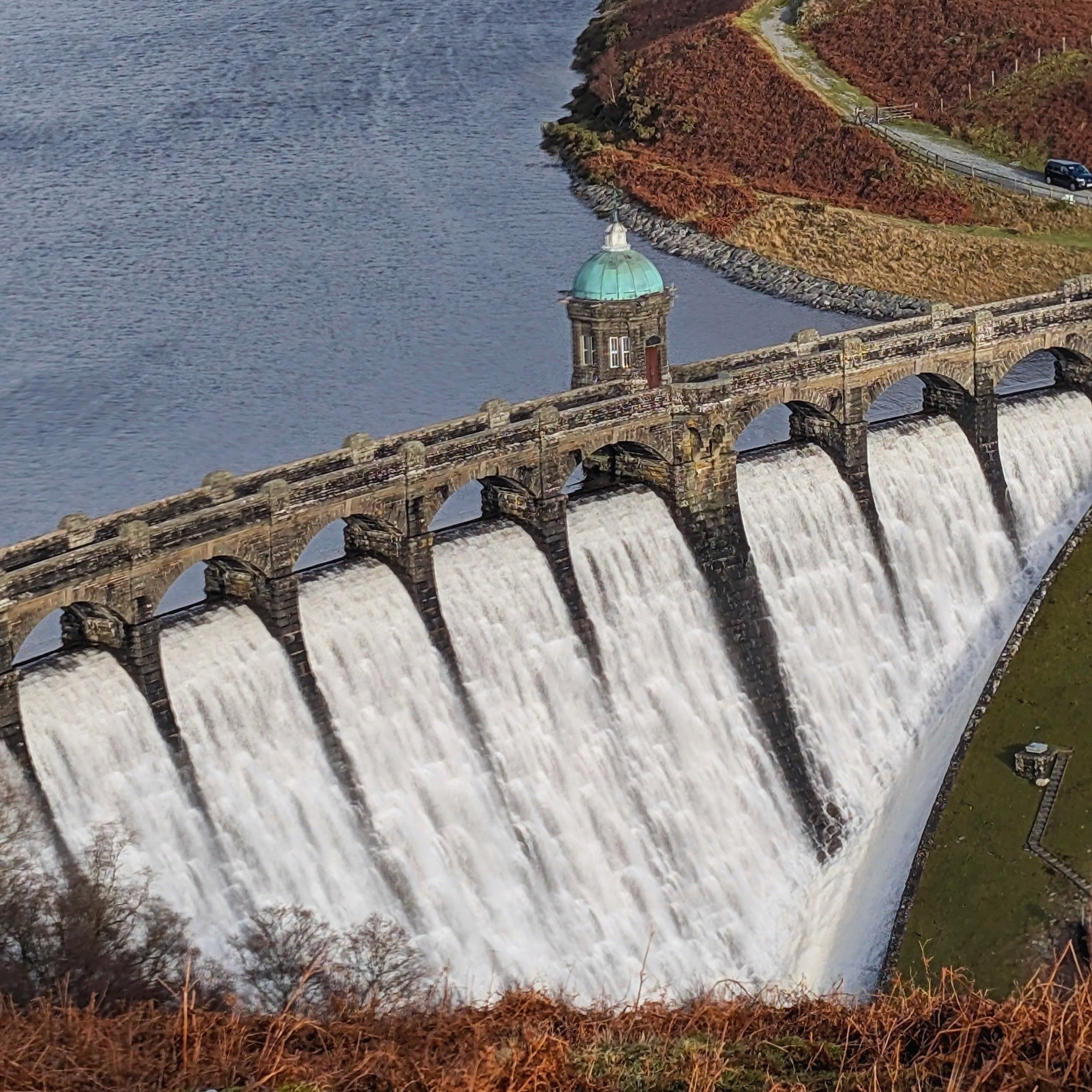 Overflowing dam at Cwm Elan in the Elan Valley, a dramatic viewpoint near Coety Bach.