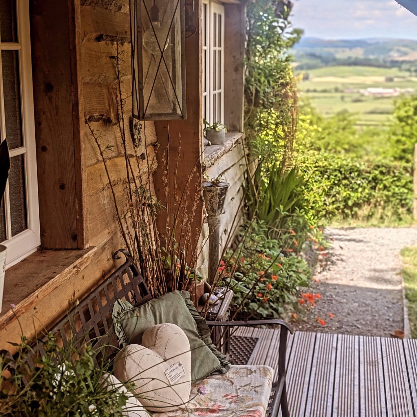 This little bench under the porch has seen a lot over the years. 🏴󠁧󠁢󠁷󠁬󠁳󠁿

Promises and proposals made, laughter shared, slow sips of coffee as the sun creeps in. &hearts;️

Wine under the stars, birdsong at first light, and cwtches that linger