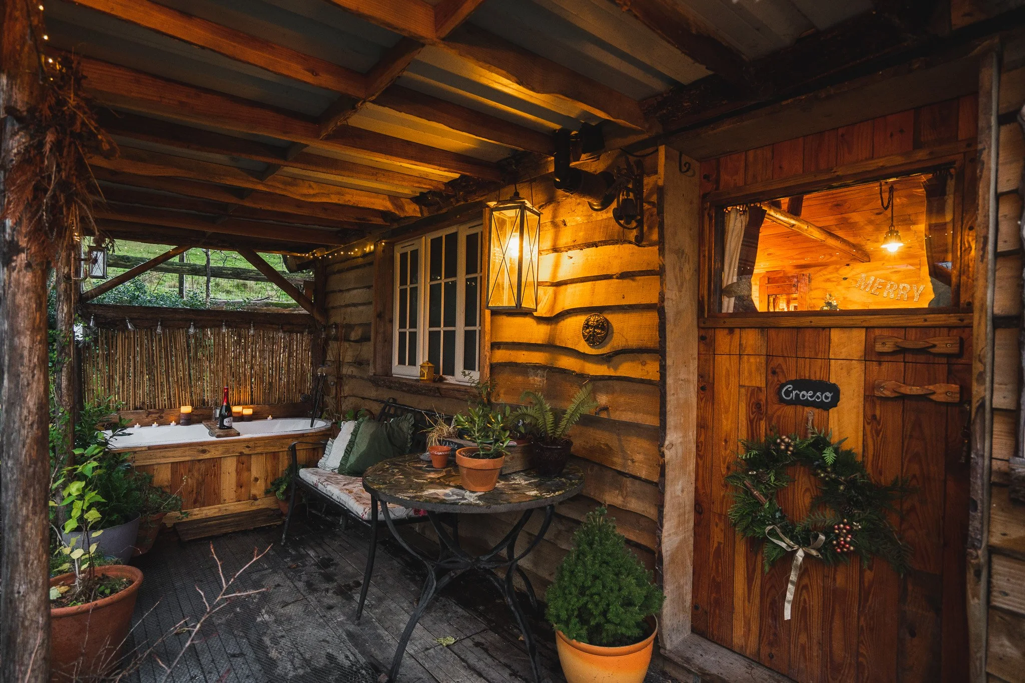 Relaxing on the porch at Coety Bach cabin after a day of dog friendly walking in Mid Wales.