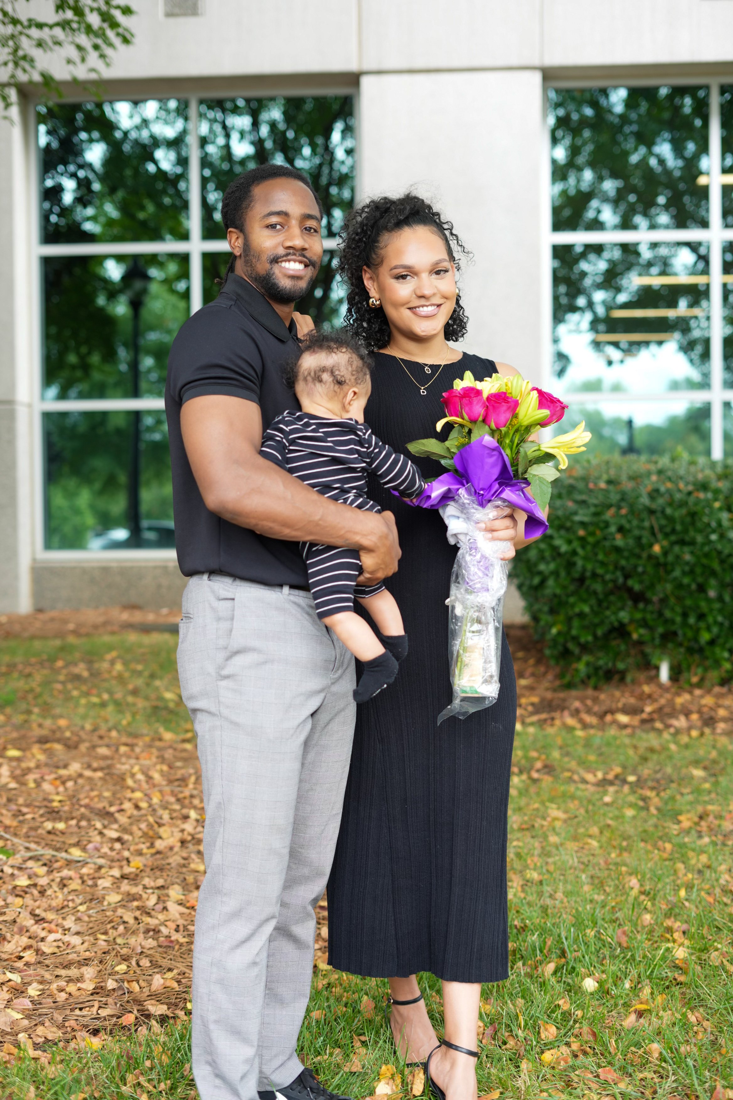 desiree and her family with flowers.jpg