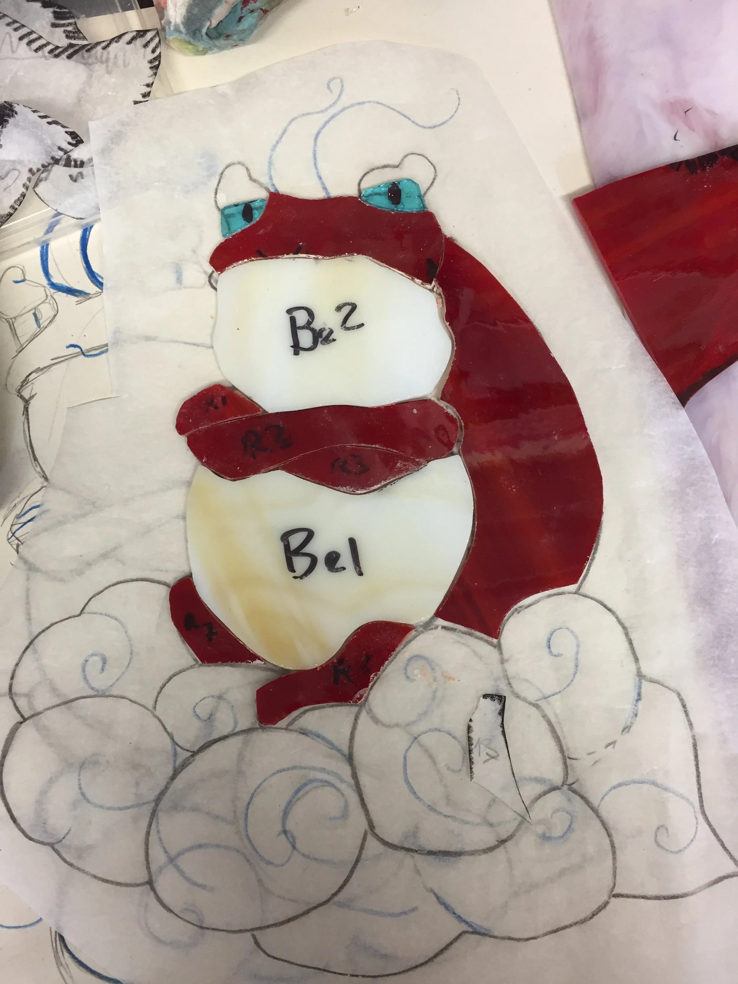 Cutting the glass of Zephos for a stained glass piece inspired by the Legend of Zelda the Wind Waker 