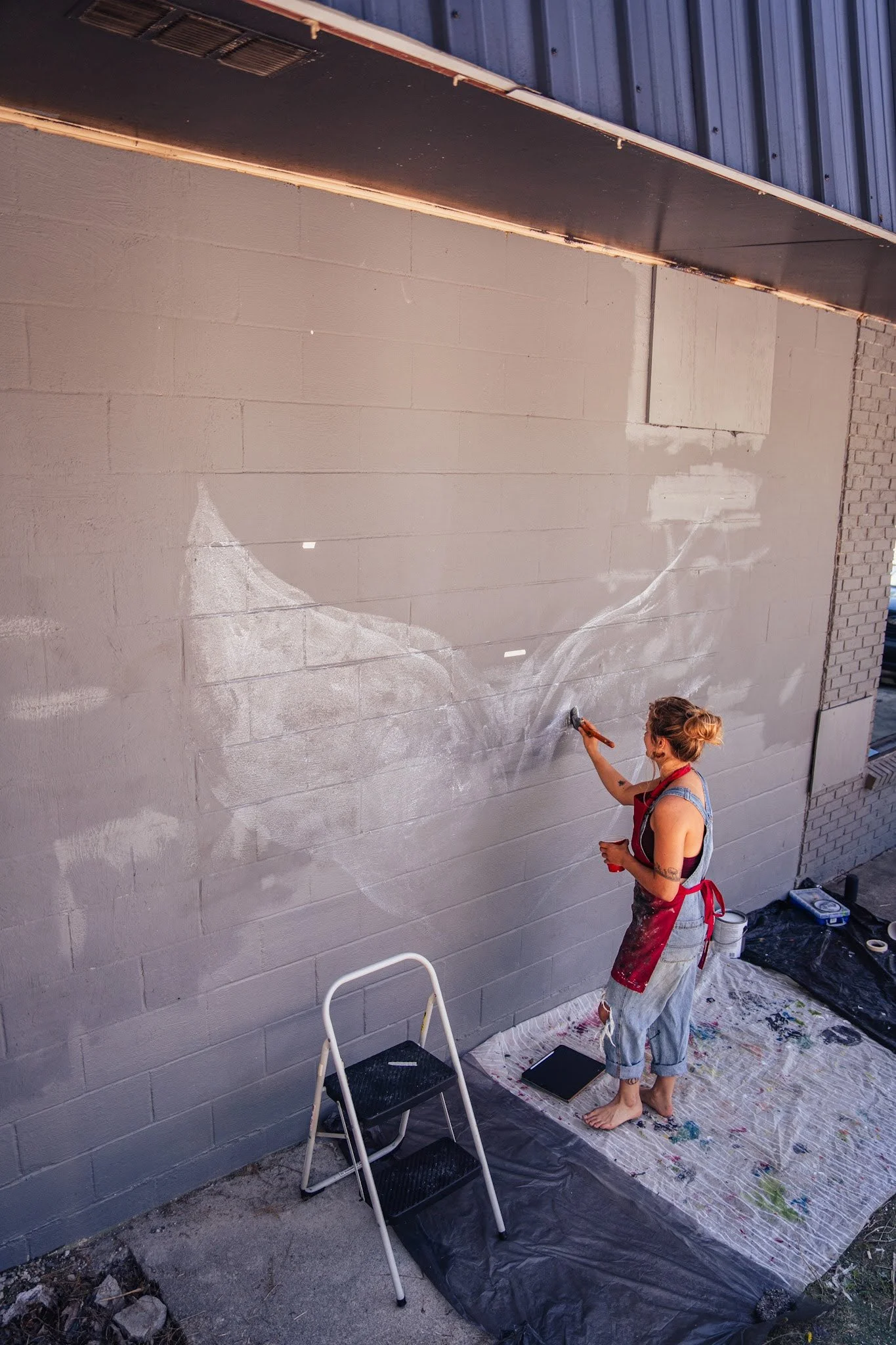 The beginning - laying down the base by free handing the shapes onto the wall.