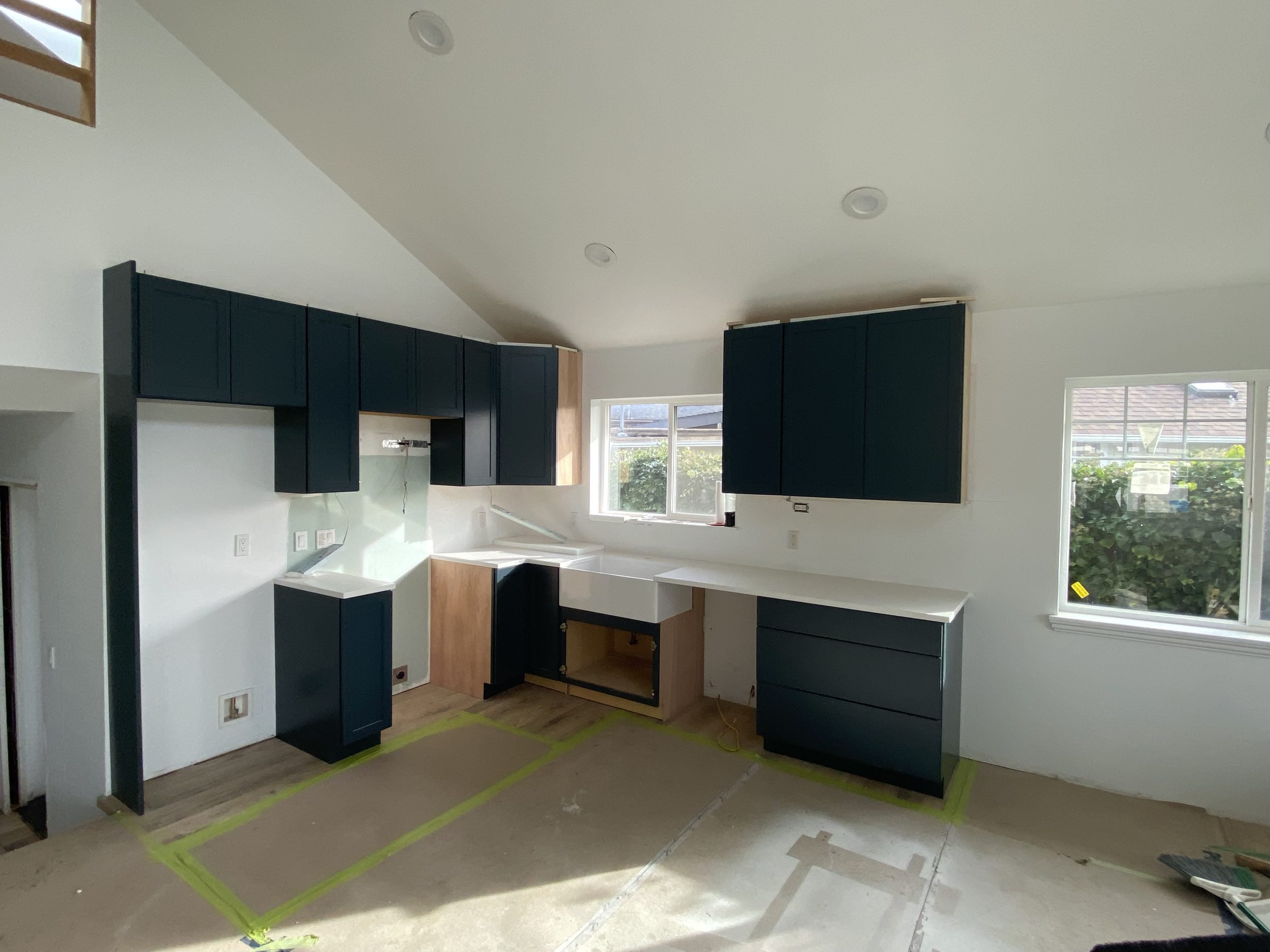 Navy shaker kitchen with quartz counters, Saturna Place