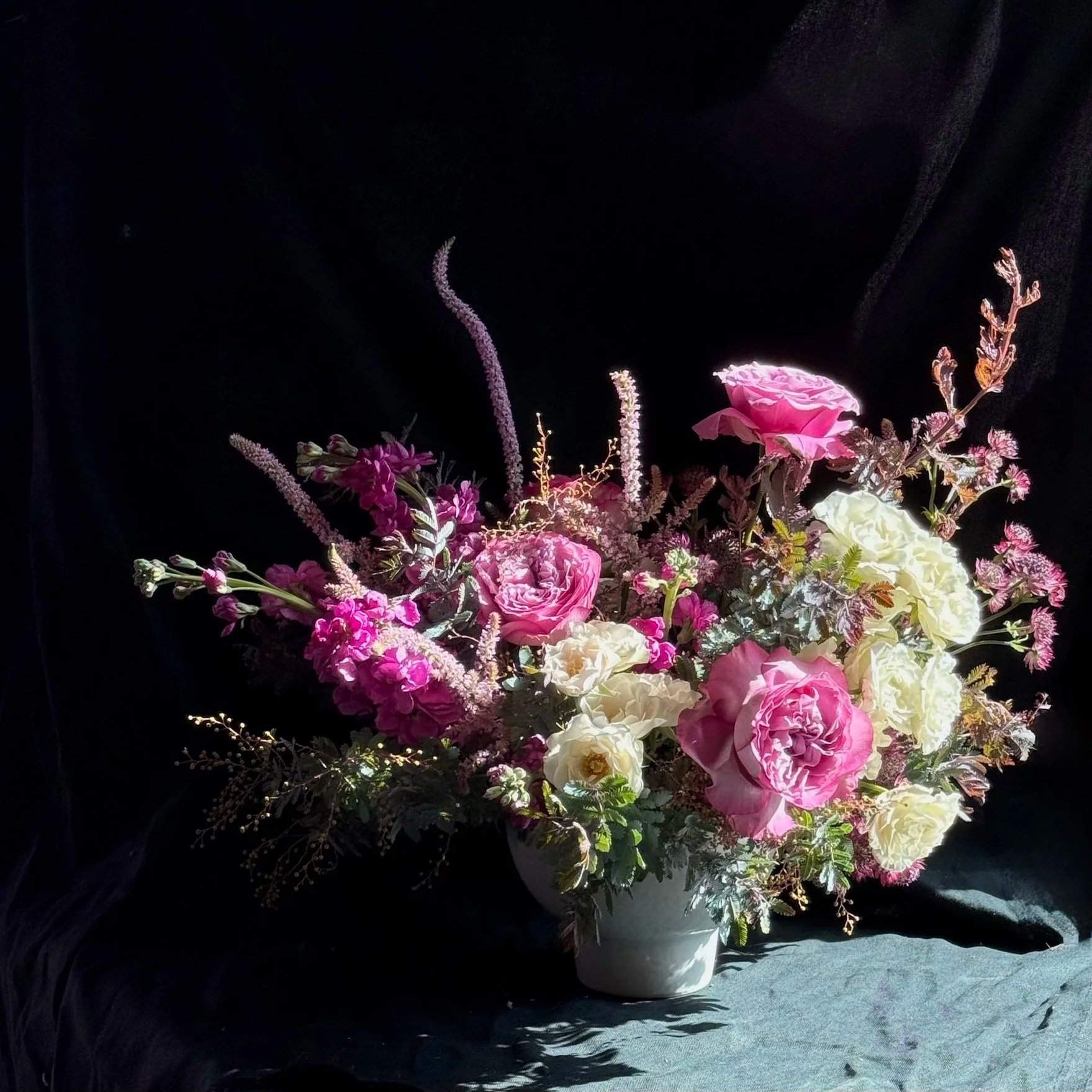 romantic valentines day arrangement in purple tones soft white with roses and unique flowers and foliage for delivery in sonoma county