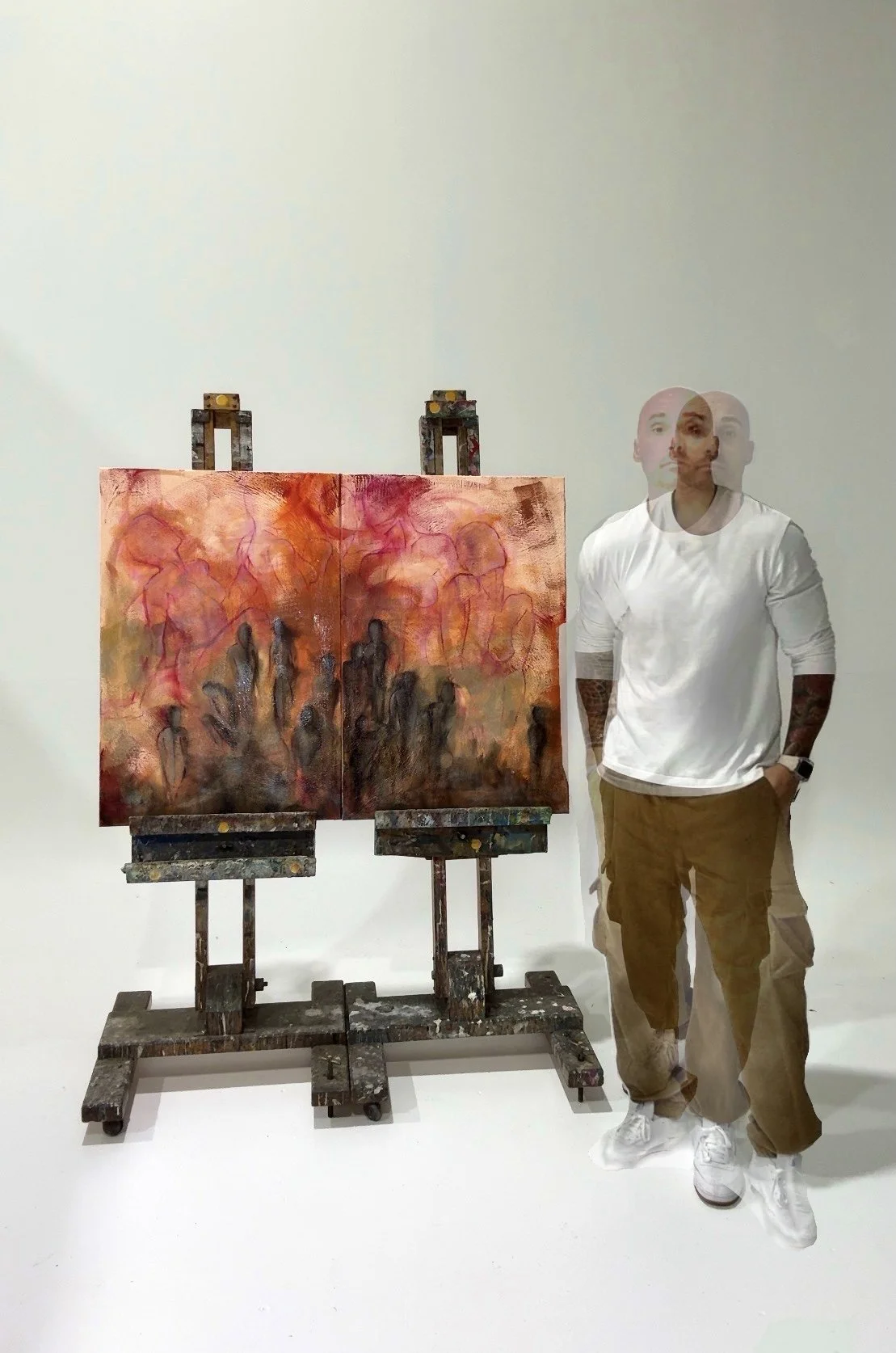 Sydney artist Daniele D’Aluisio in studio with abstract mixed media painting on resilience and nature themes.