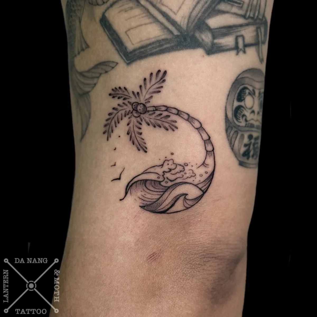 Illustrated style Wave and Palm tree tattoo in Da Nang, Vietnam.