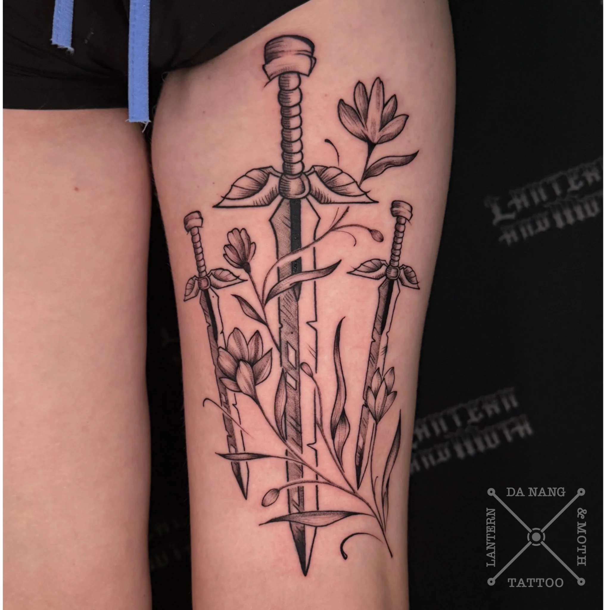 Knives and Flowers design by Da Nang fine line tattoo artist.