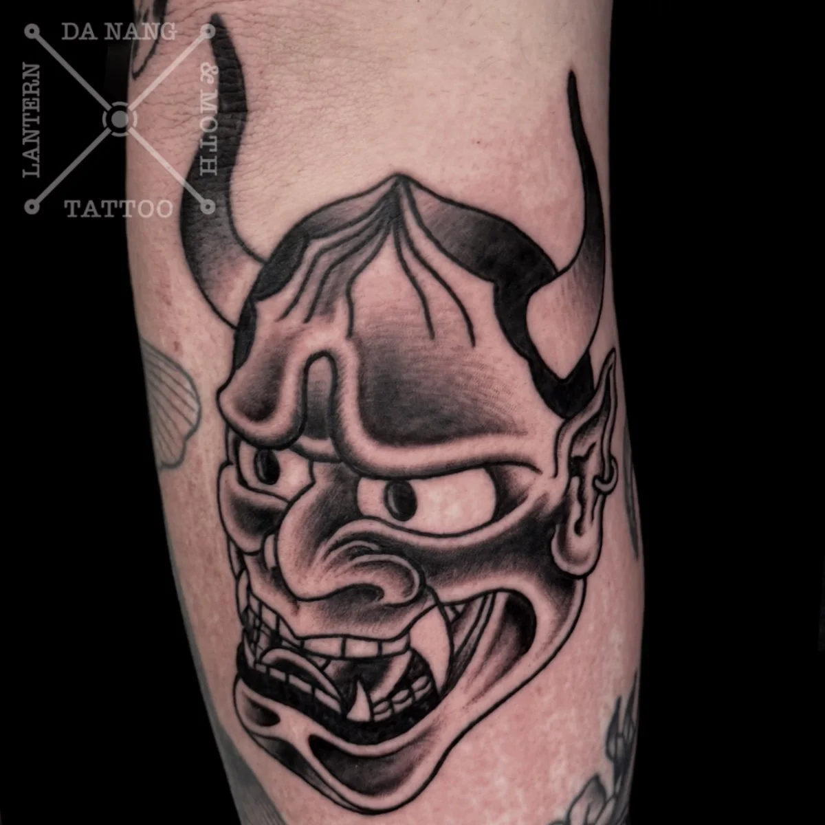 Black Traditional Hanya Mask Tattoo by Lantern And Moth Tattoo, Da Nang, Vietnam.
