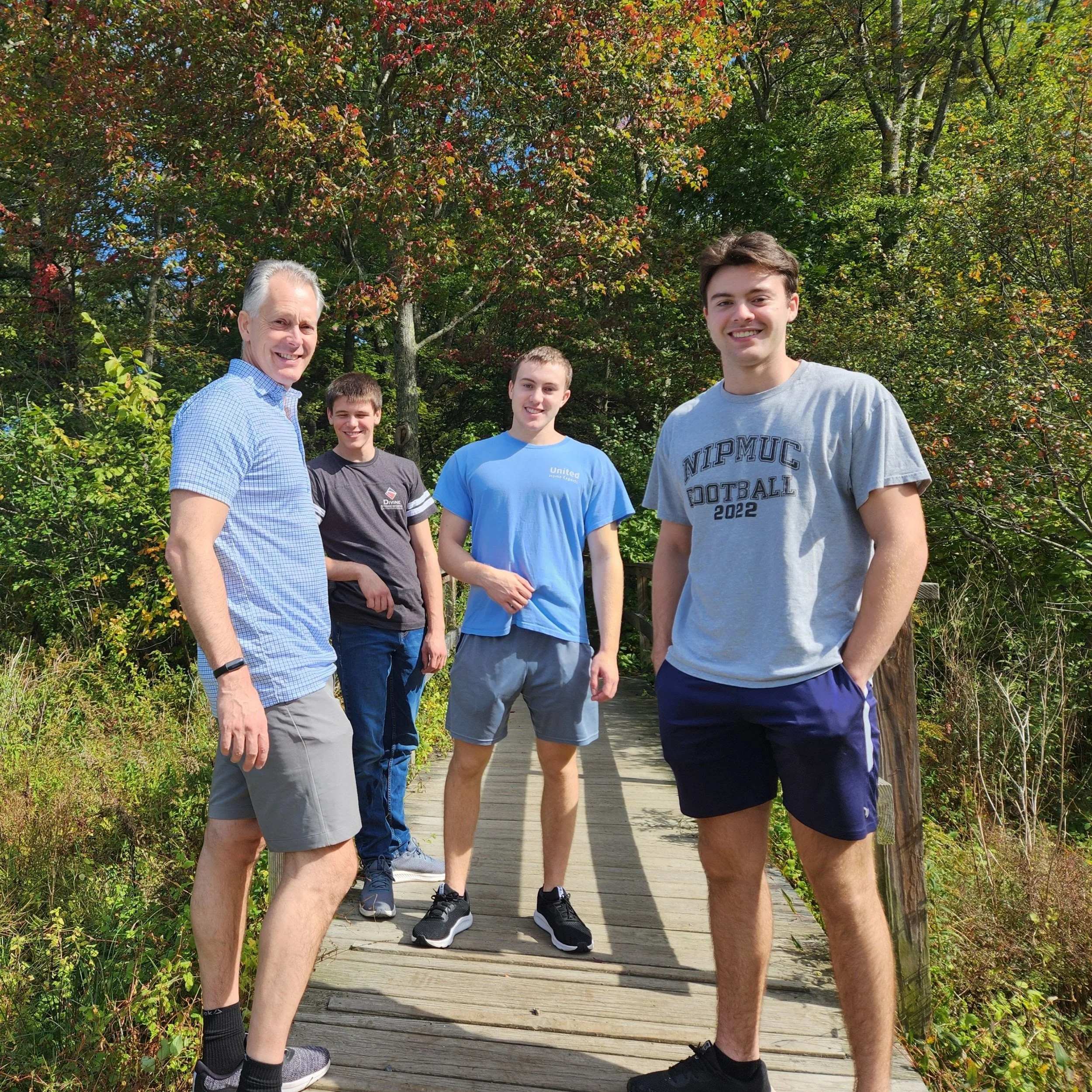 My husband and sons on a walking trail