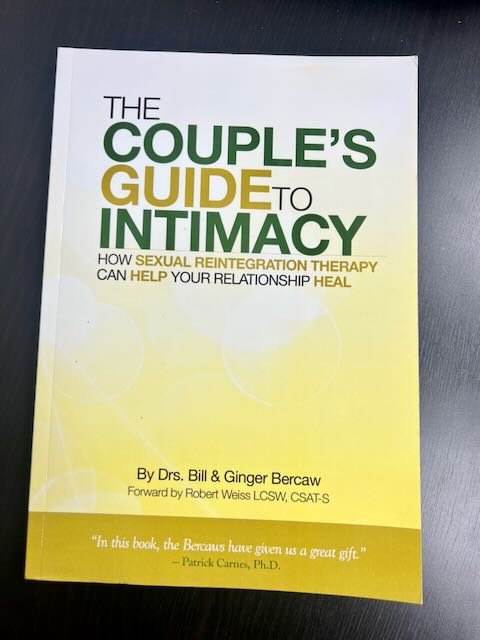 Book titled 'The Couple's Guide to Intimacy' with subtitle about sexual reintegration therapy, authored by Drs. Bill and Ginger Bercaw, with a forward by Robert Weiss.