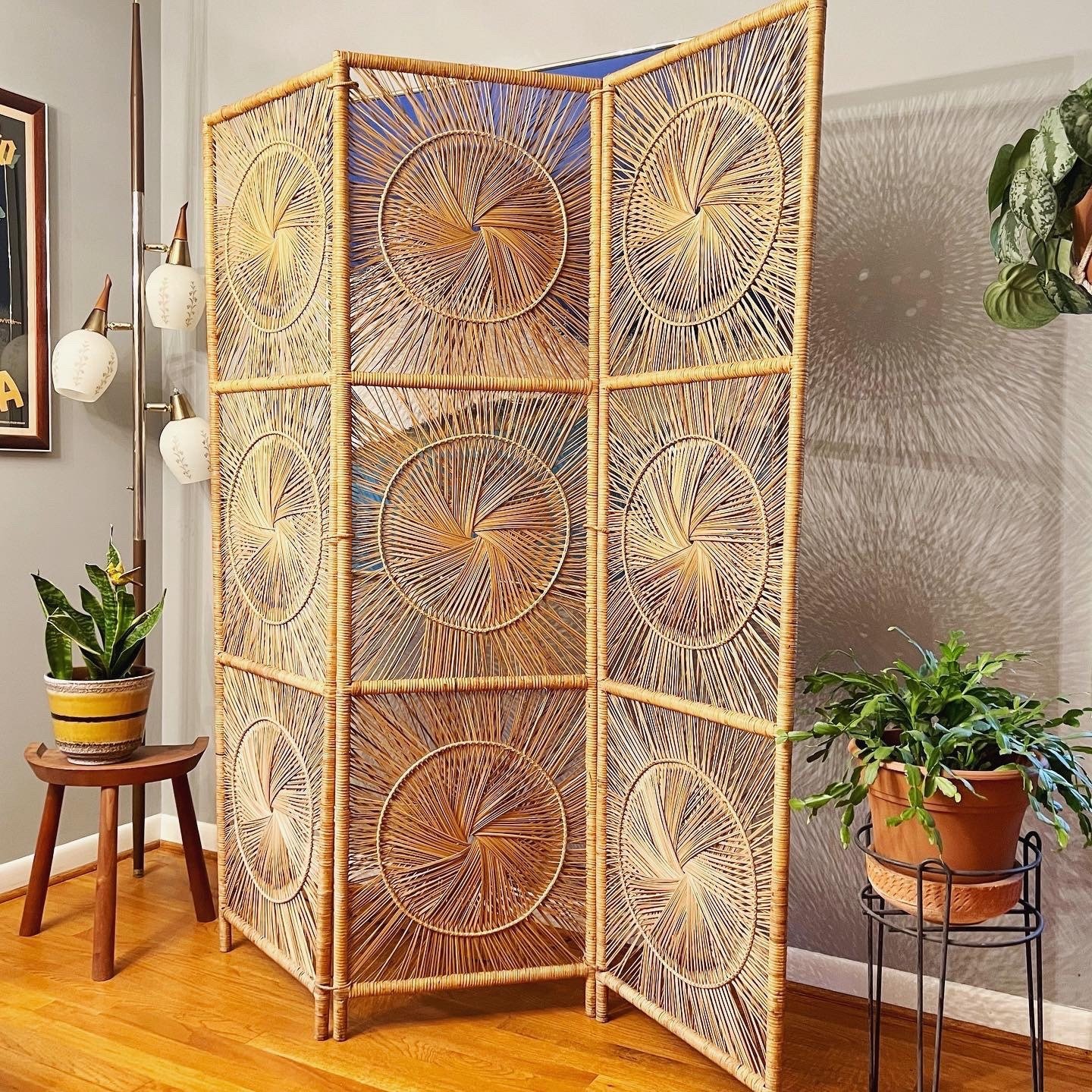 Vintage starburst room divider made of natural rattan, a stylish and functional addition to your space.