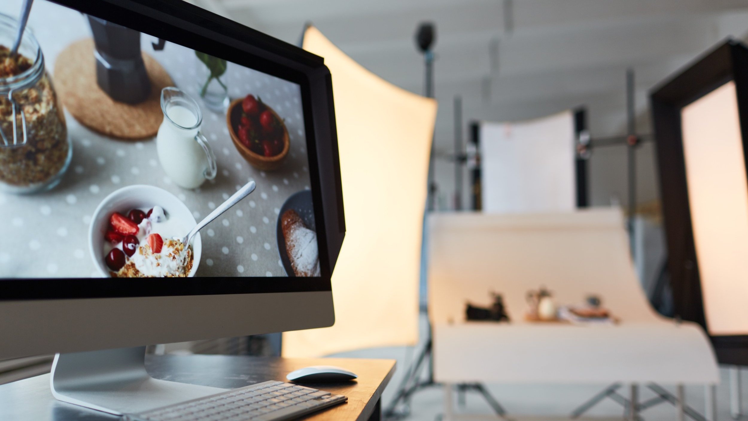 computer with photoshoot going on in the background