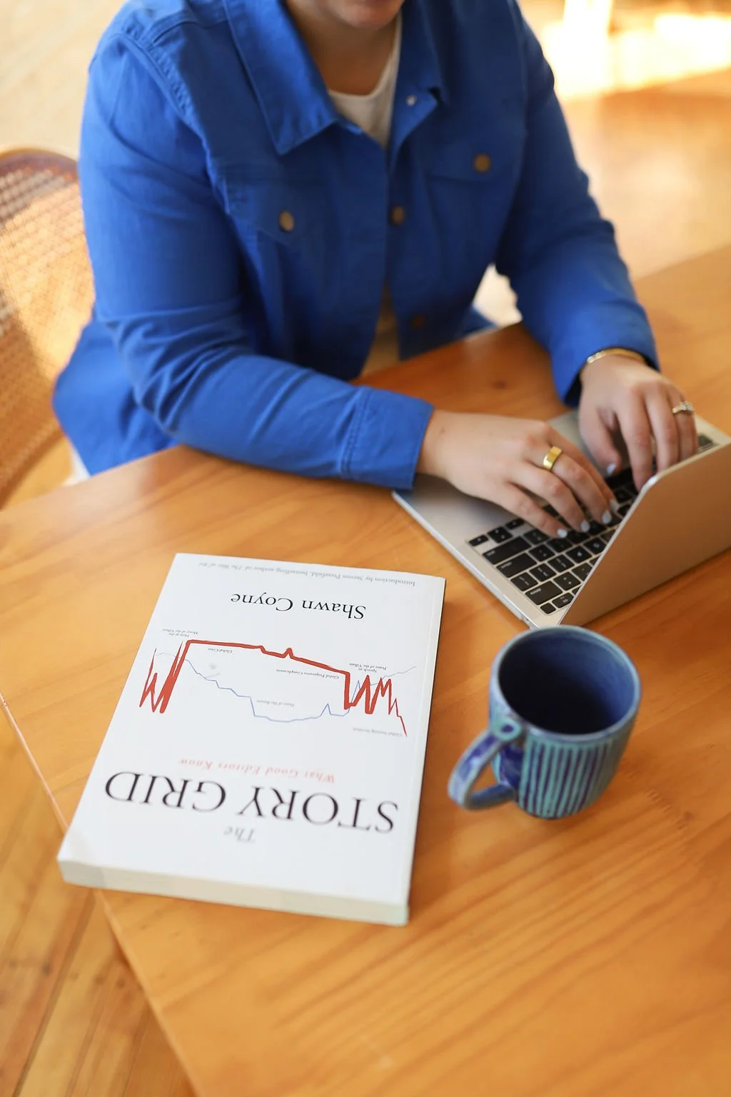 Book with glasses and blue waves for developmental edit for science fiction stories.