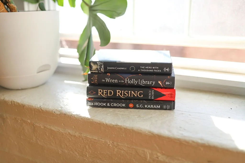 Picture of a typewriter and a writing craft book for writers.