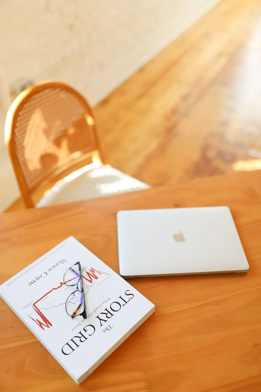 Image showing the laptop screen of a writer writing a book for manuscript evaluation.