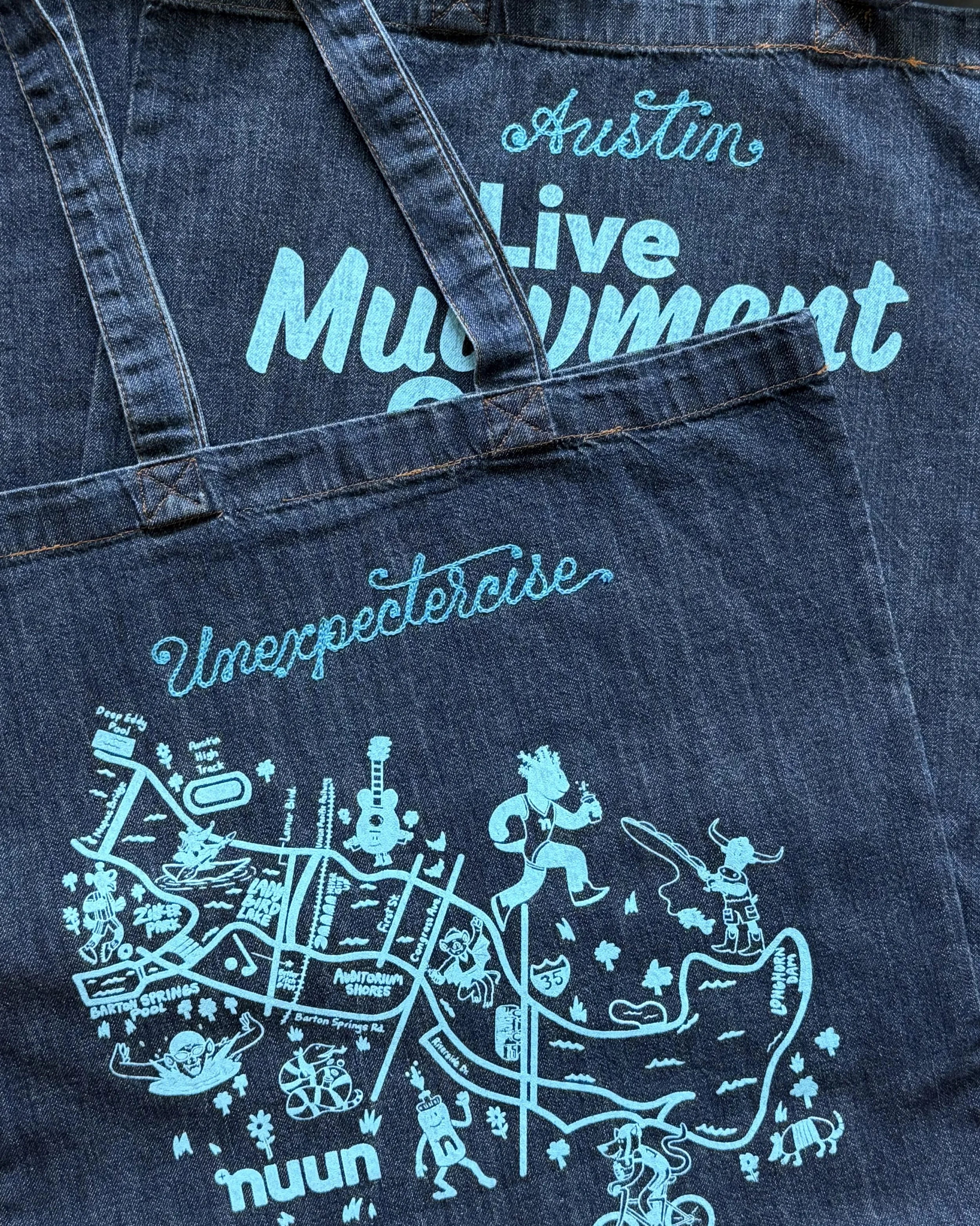 Back of denim jacket with screen printing and custom chainstitch embroidery. Double Vision was in Austin to provide live embroidery for runners at a Nuun Hydration event.