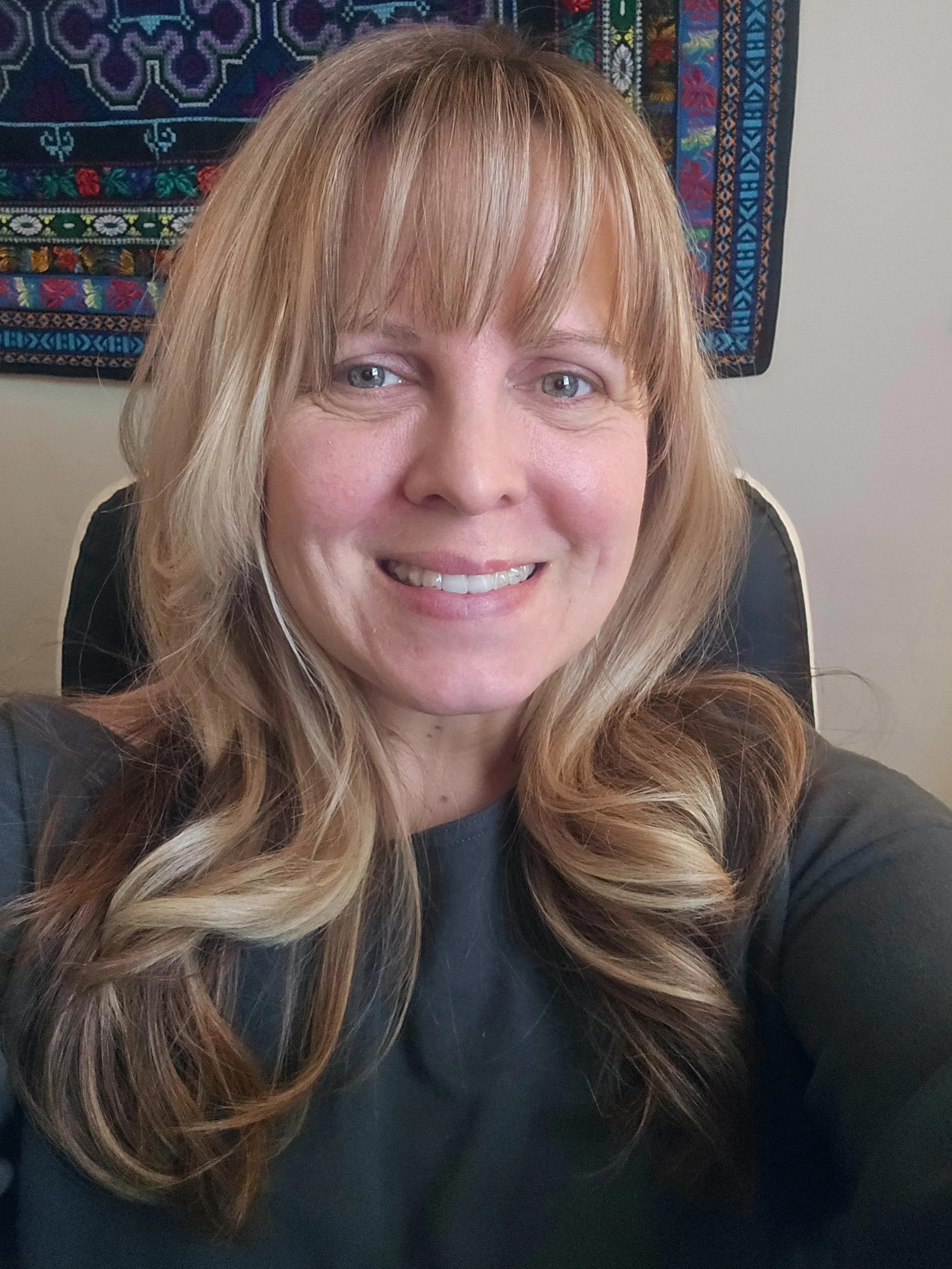 an image of Danielle Ecker smiling at the camera