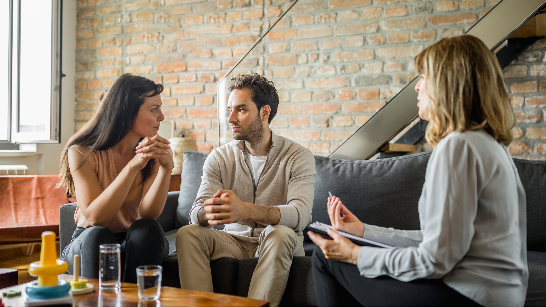 Young couple having a supportive conversation during couples therapy