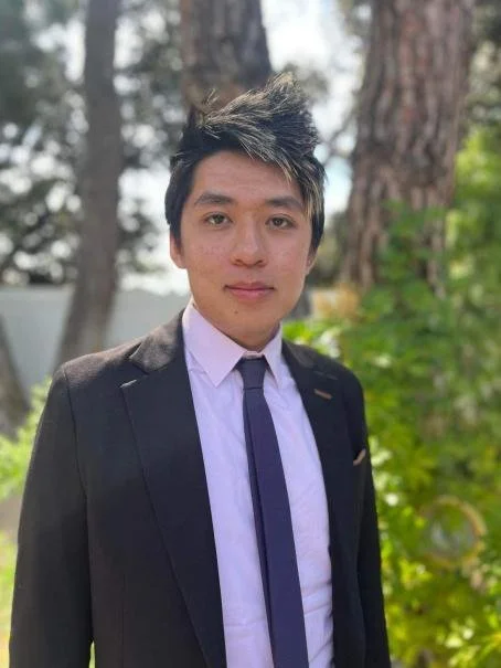 an image of Andrew Vuong smiling at the camera