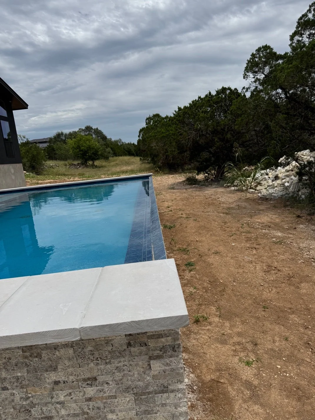 Modern residential pool featuring clean geometry and seamless design