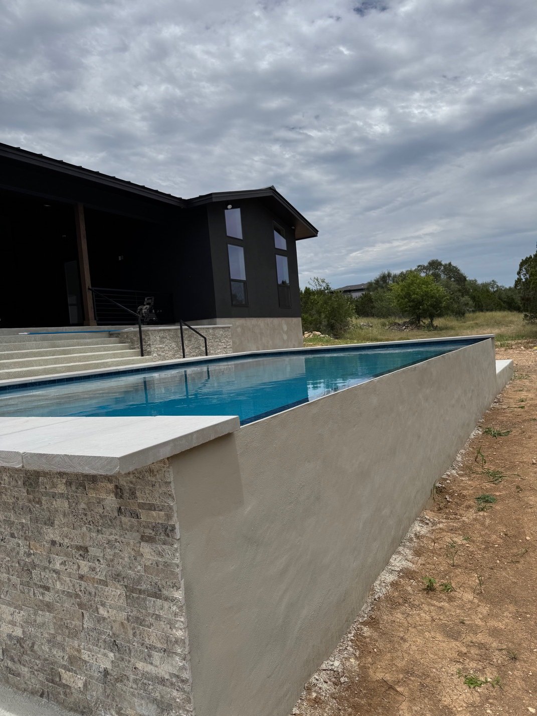 Minimalist backyard pool designed for relaxation and outdoor living