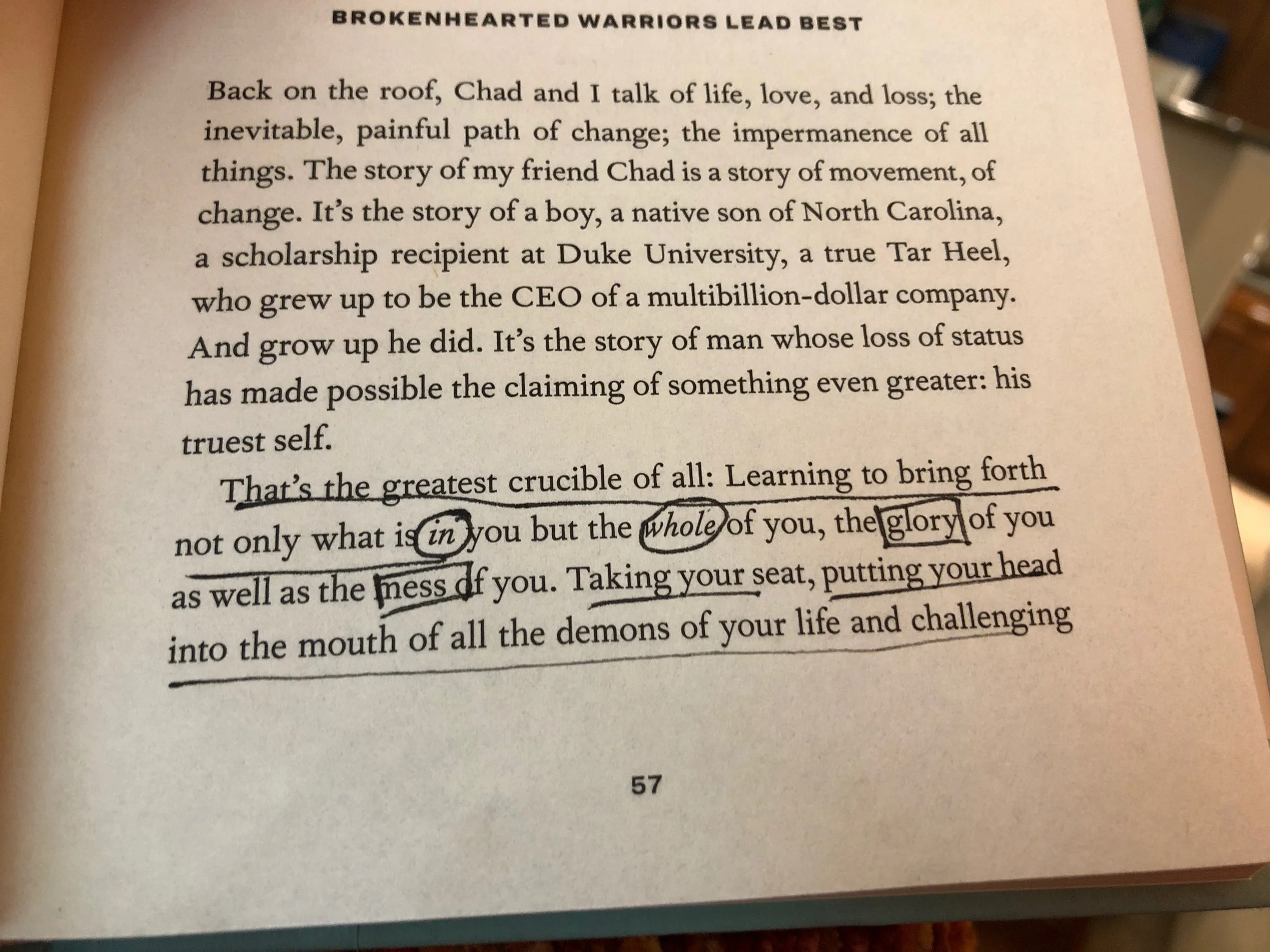 A page from a book with underlined text and handwritten annotations. The page contains a paragraph about man’s growth and loss of status, and highlights a quote about bringing forth the whole of oneself, with words like "in," "whole," and "glory" cir