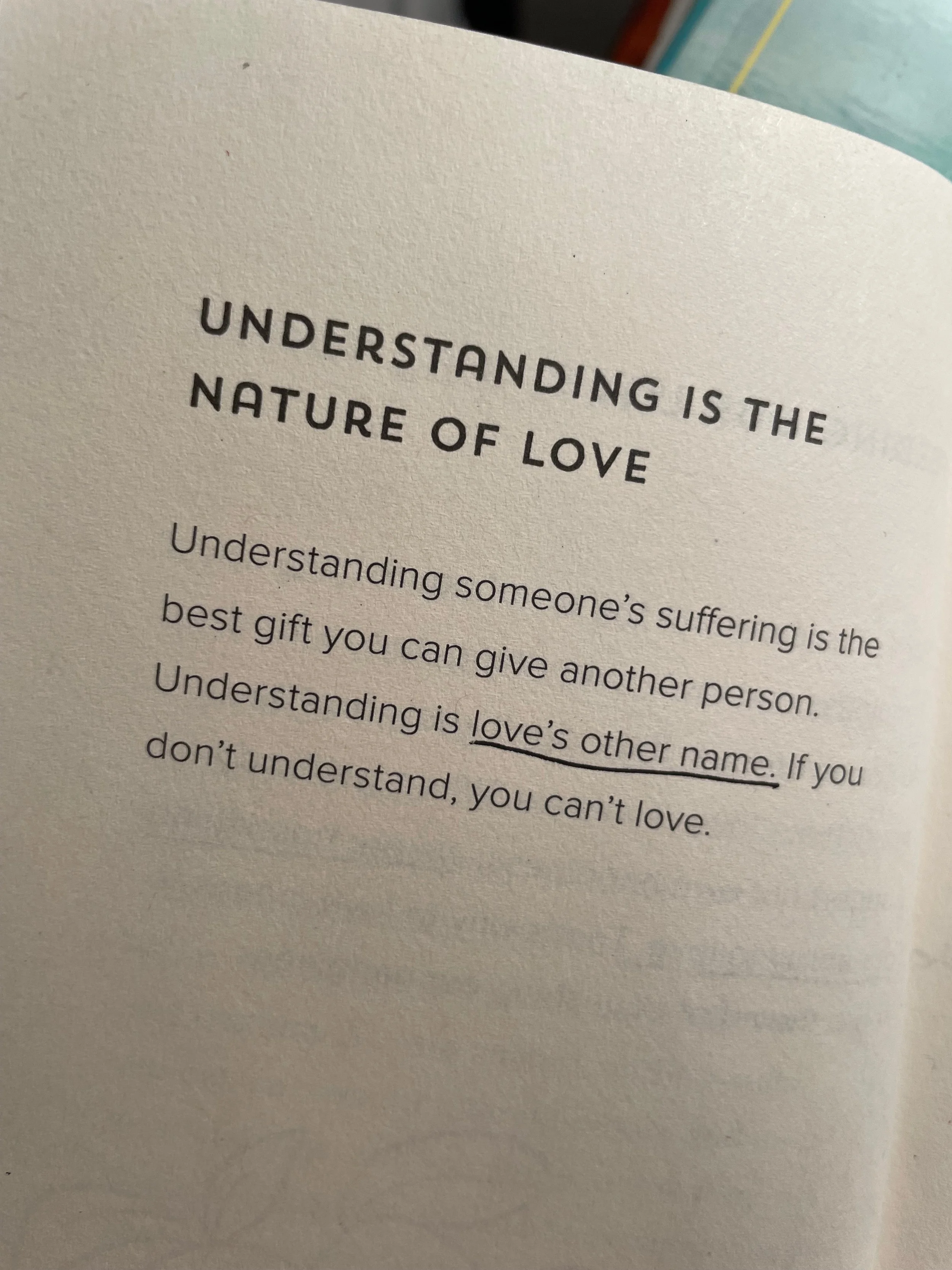 Page with text about understanding being the nature of love, emphasizing the importance of understanding someone's suffering as the best gift.