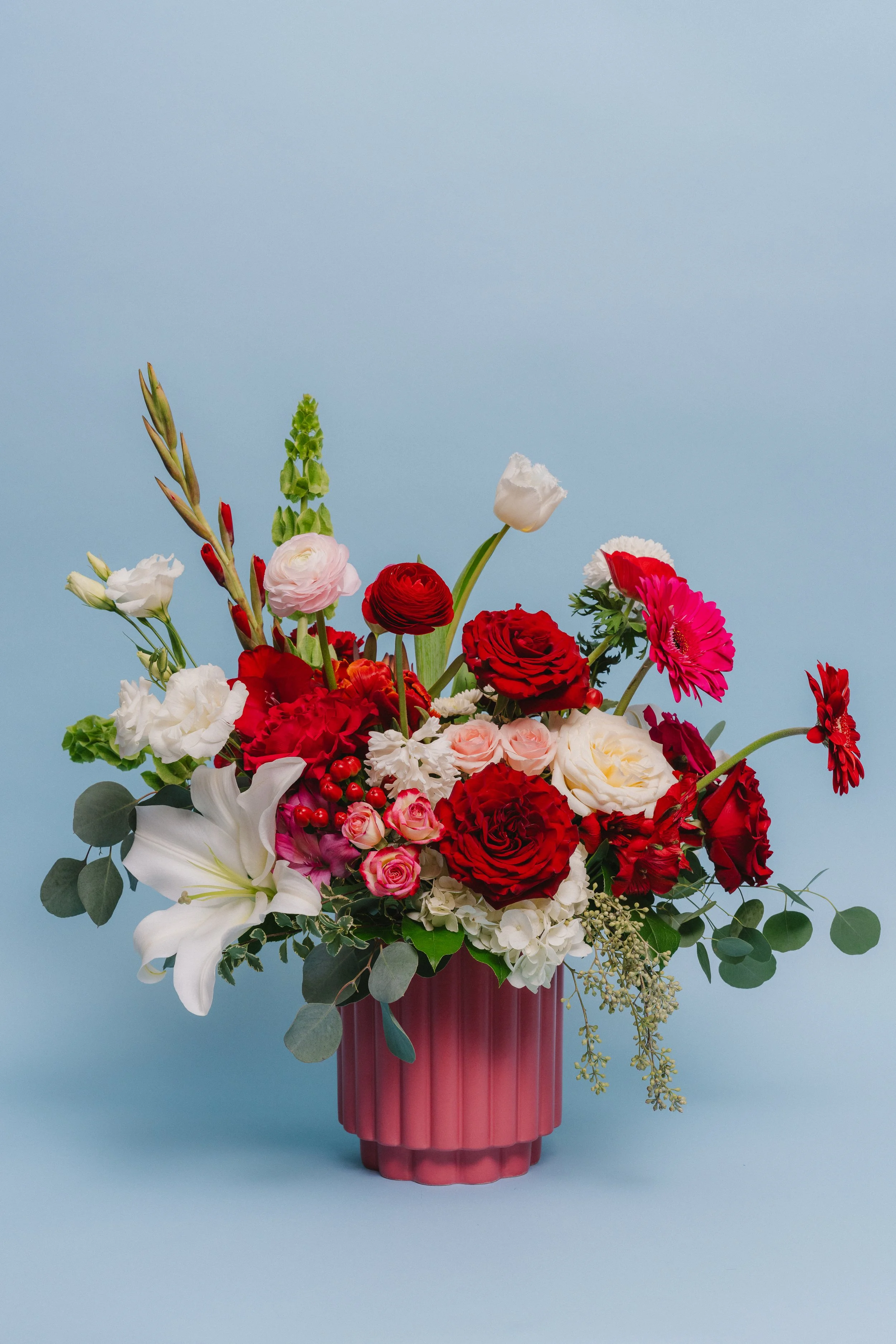 Big Love - a large, low lush style bouquet in a deep pink ceramic pot filled to overflowing with an array of beautiful Valentine varieties. $249.95   
*Varieties may vary depending on availability and awesomeness.