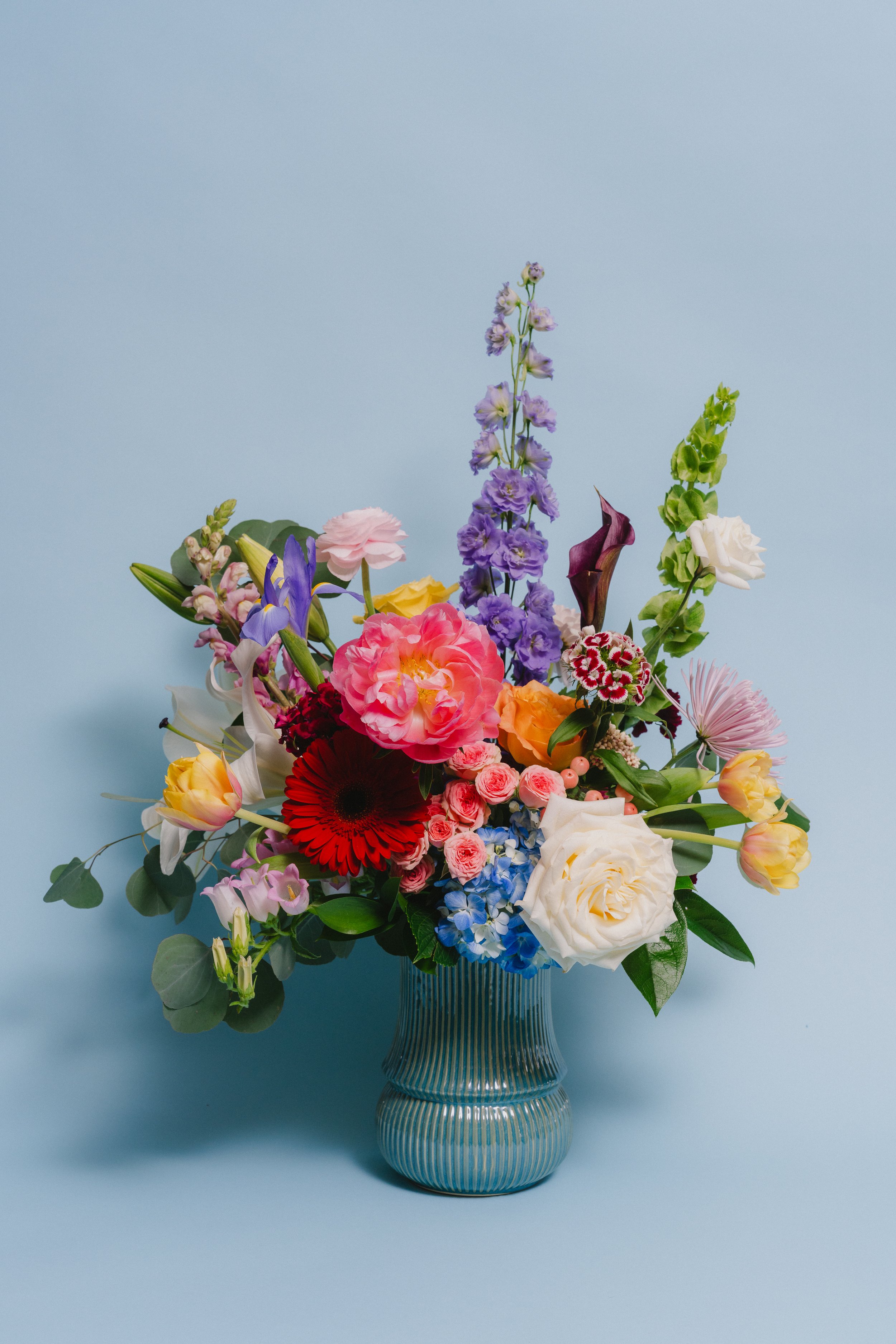 Mother's Garden - a large array of garden favorites artfully arranged in a unique ceramic vase. Varieties will vary depending on availability - $179.95 