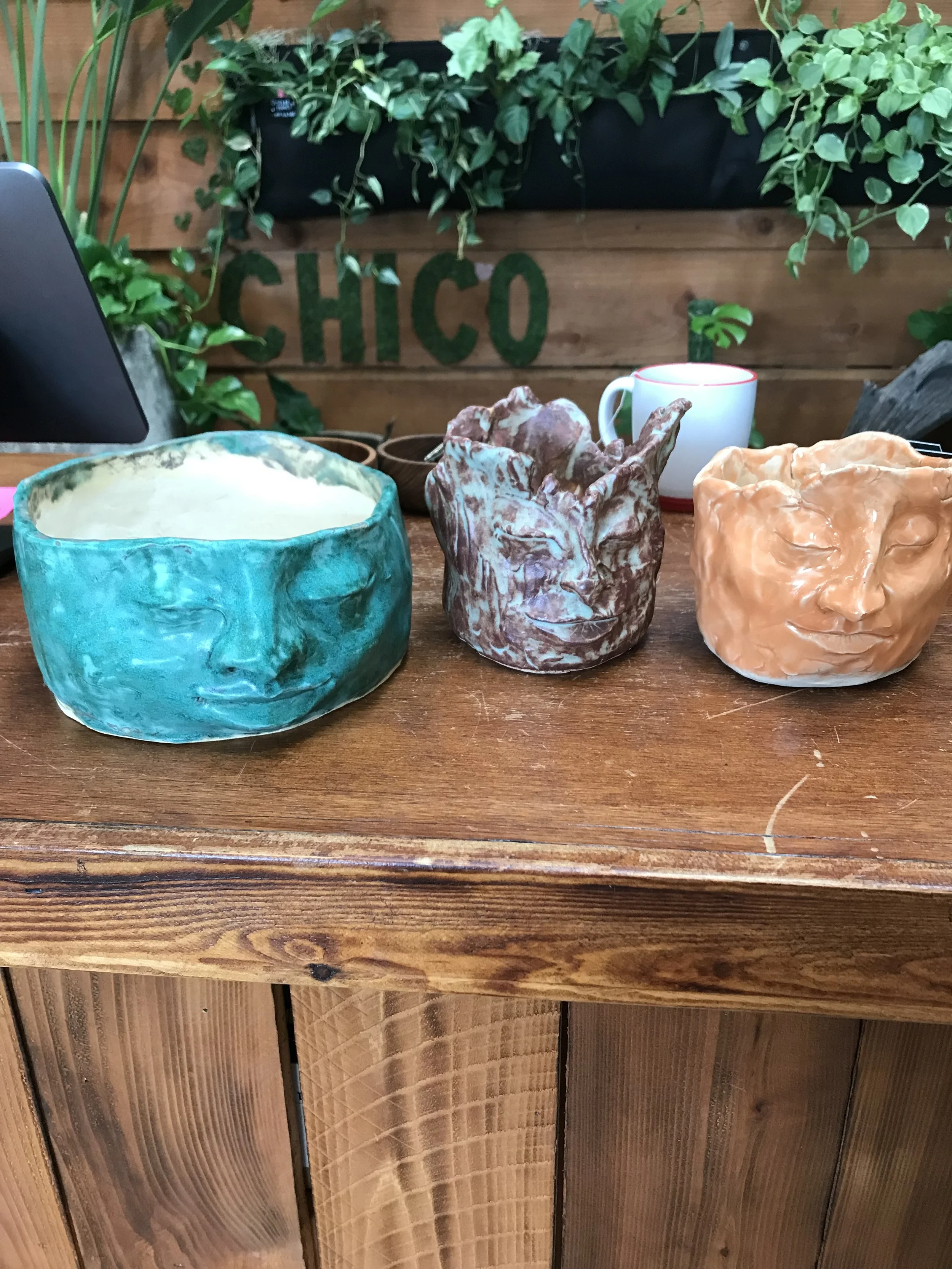 Some of my first face pots.