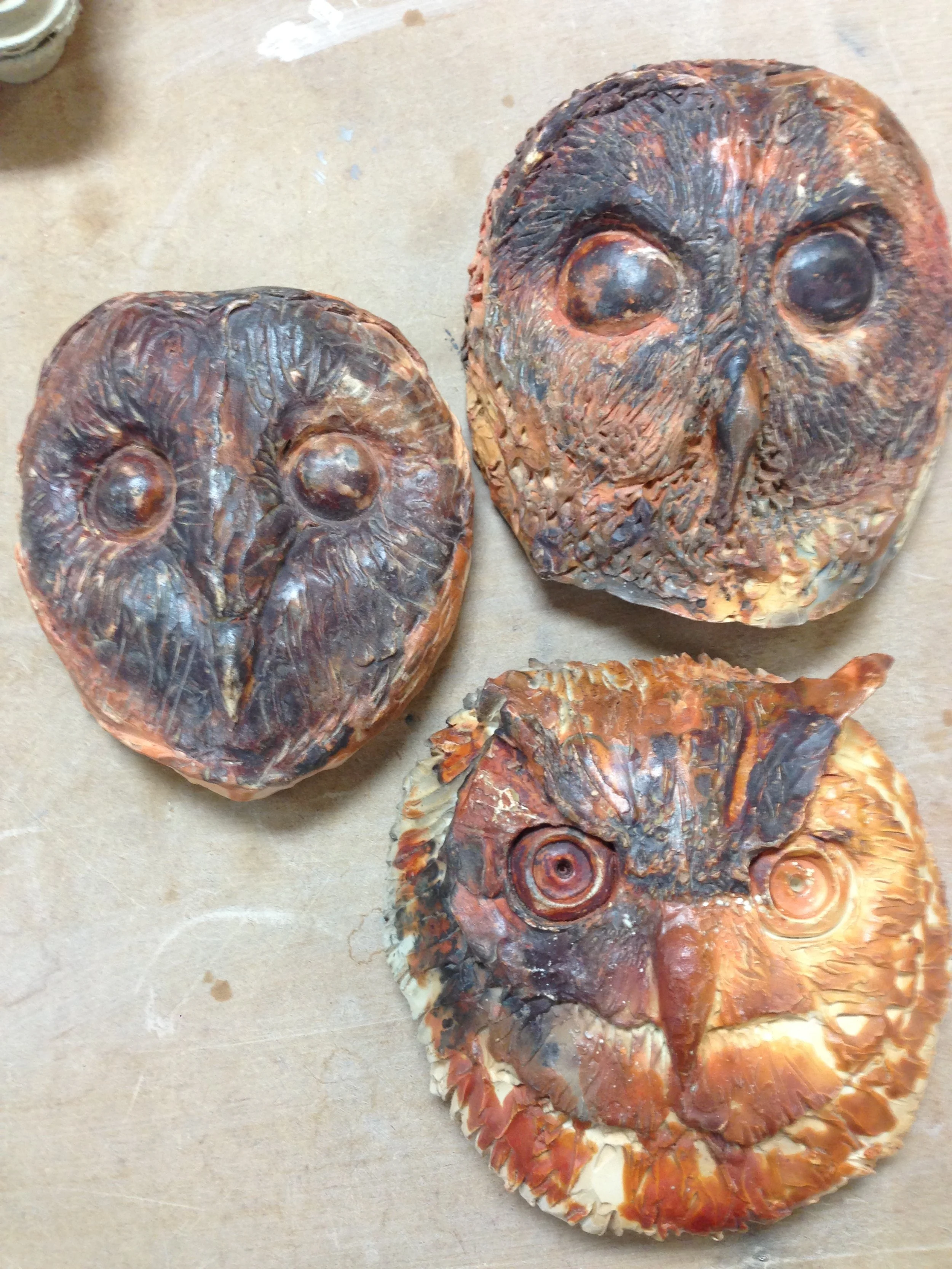 Pit fired owl masks.