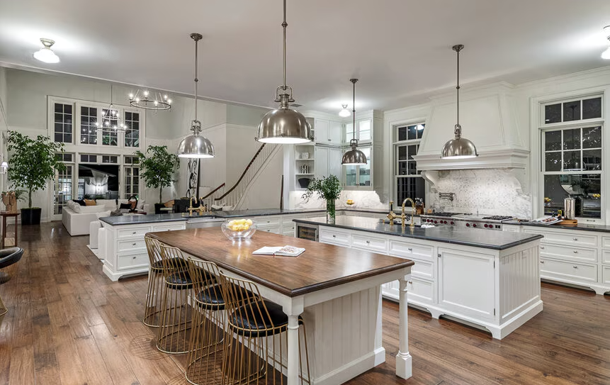 The Brentwood Park kitchen has a sophisticated yet functional layout featuring two large islands and high-end finishes.