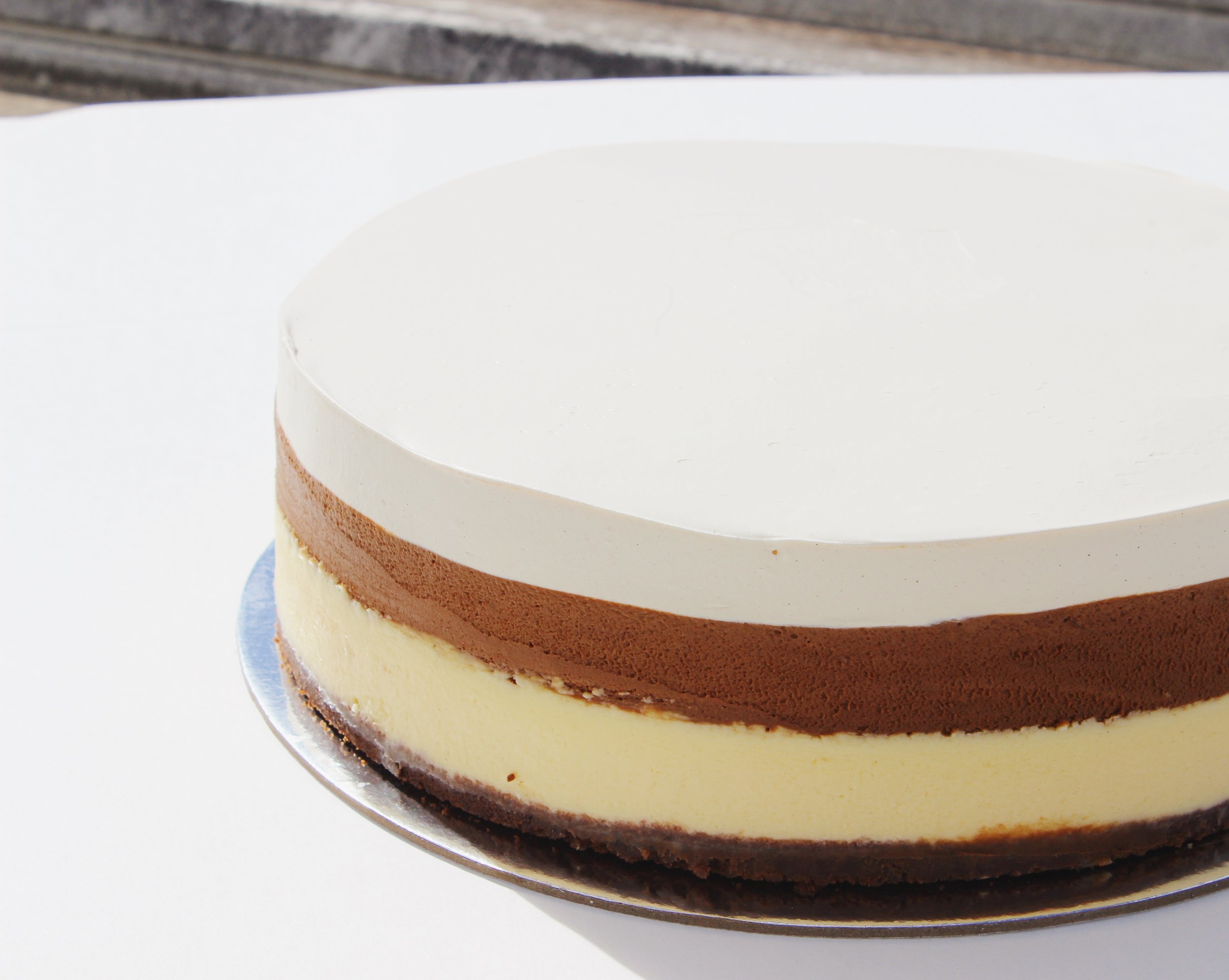 Our iconic Mortal Sin Cake, a layered cake starting with Chocolate mud cake, slow baked New York Cheesecake, hand folded dark chocolate coverture mousse finished with an airy butterscotch cream.